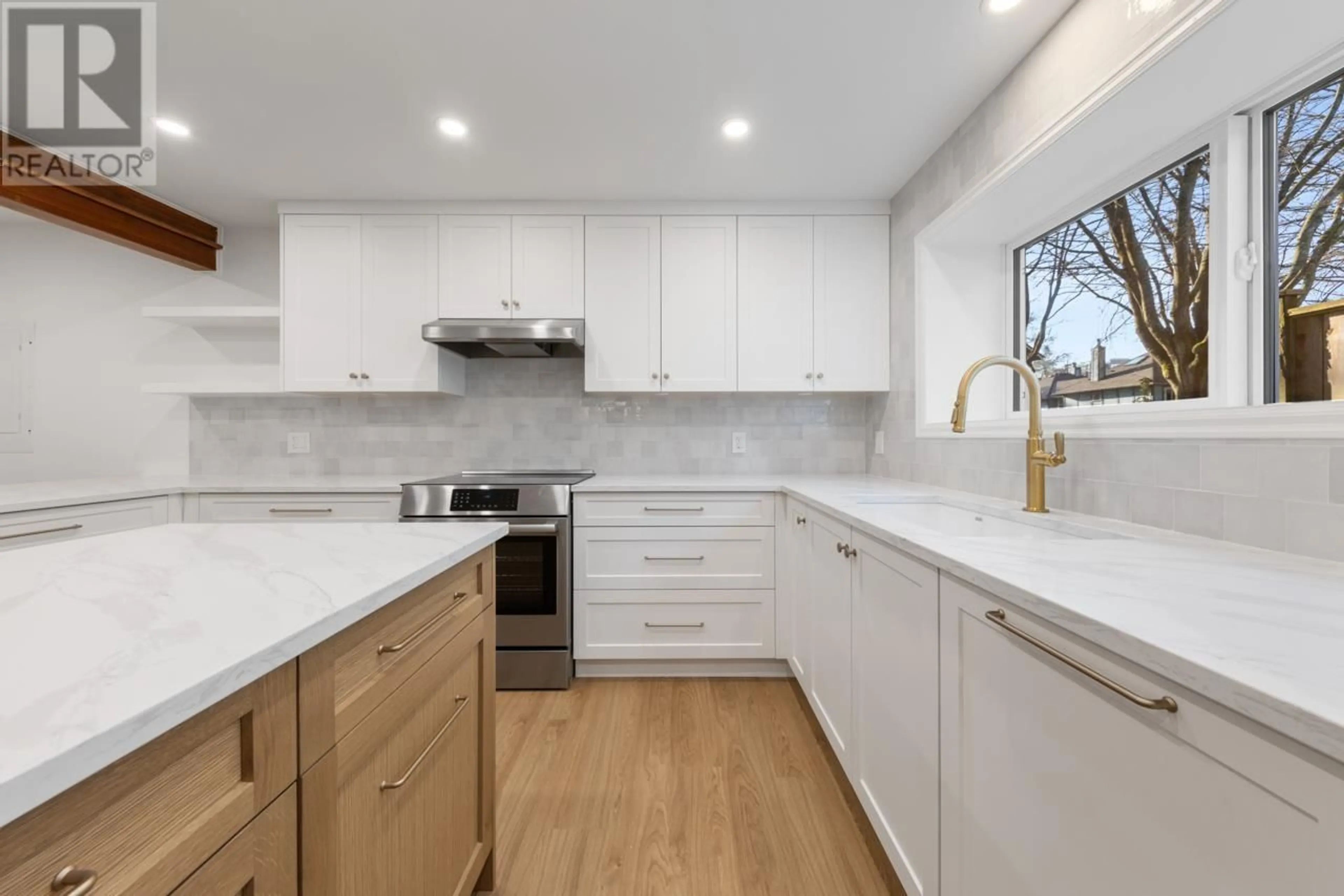 Contemporary kitchen, wood floors for 2991 YUKON STREET, Vancouver British Columbia V5Y3W1