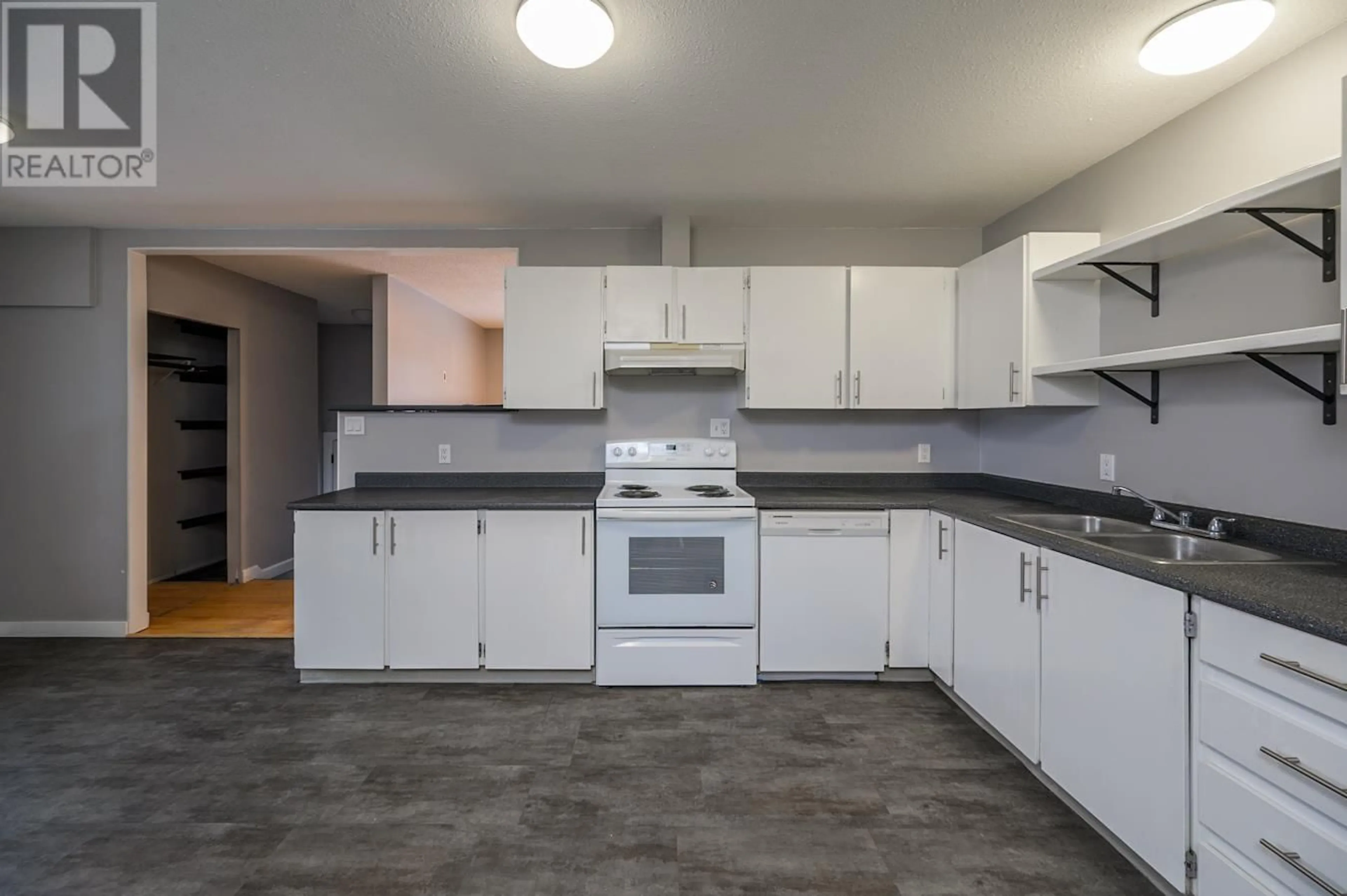 Standard kitchen, cement floor, cottage for 7130 GUELPH CRESCENT, Prince George British Columbia V2N4A4