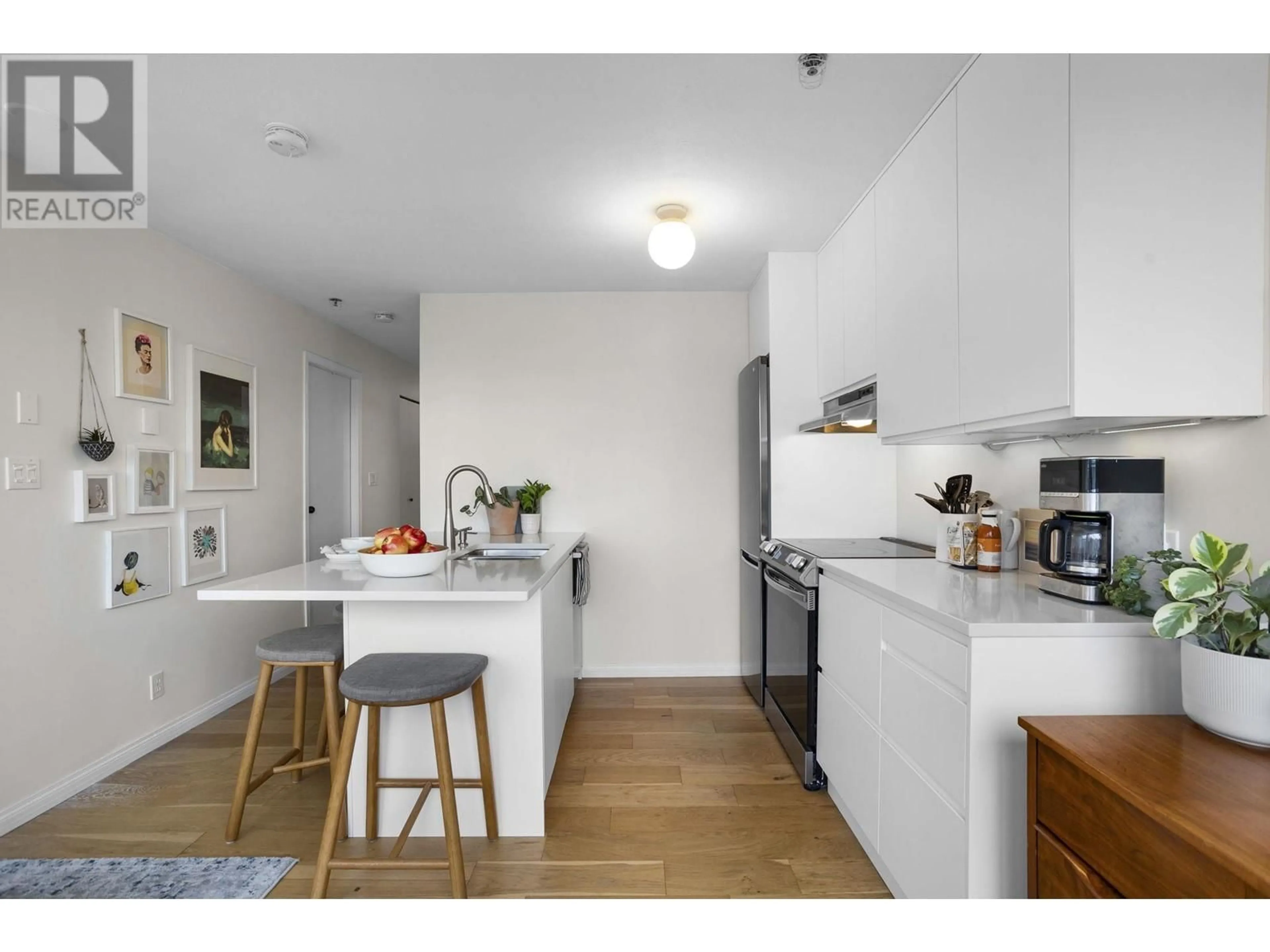 Standard kitchen, wood floors for PH1 4113 FRASER STREET, Vancouver British Columbia V5V4E9