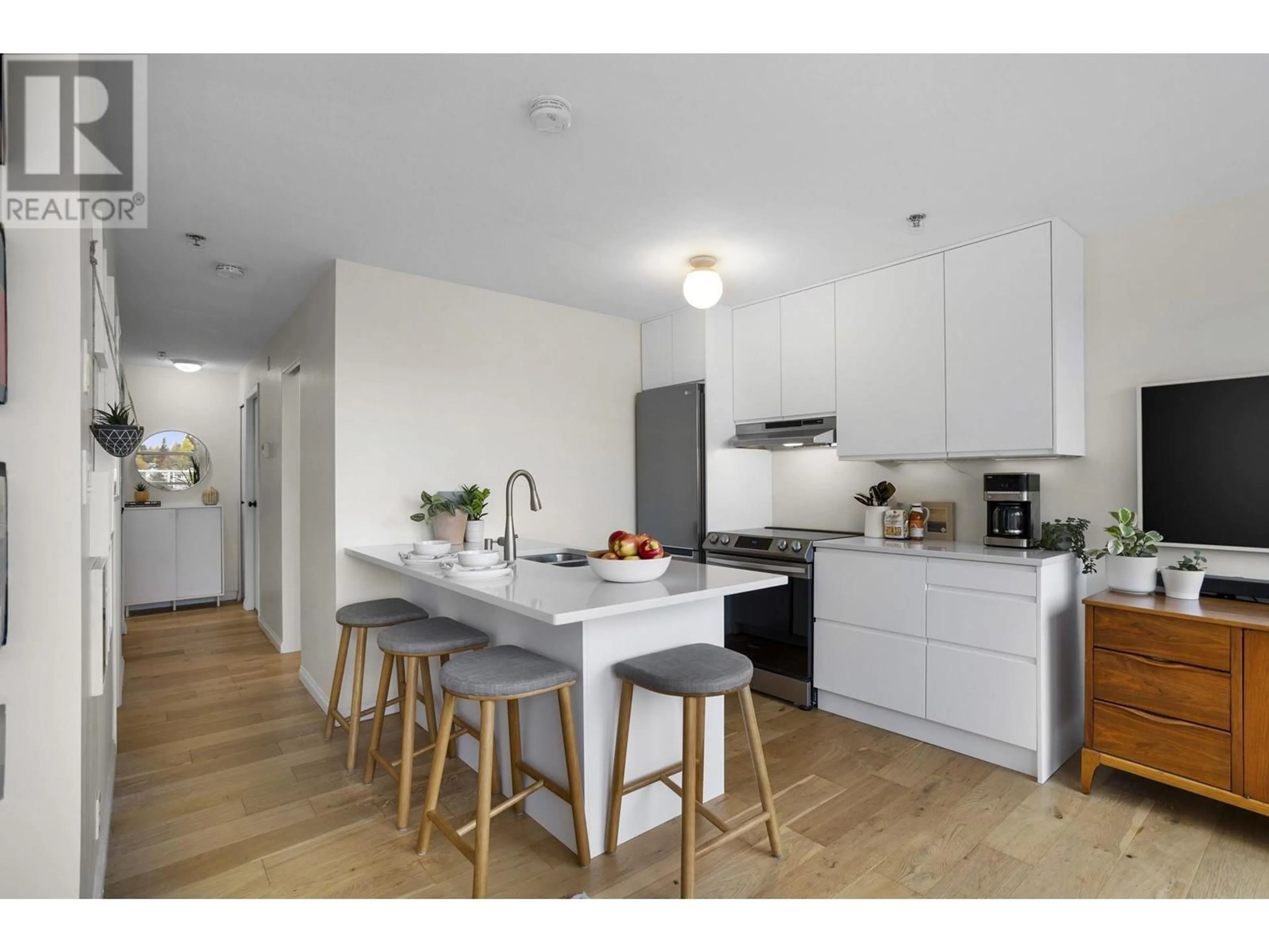 Open concept kitchen for PH1 4113 FRASER STREET, Vancouver British Columbia V5V4E9