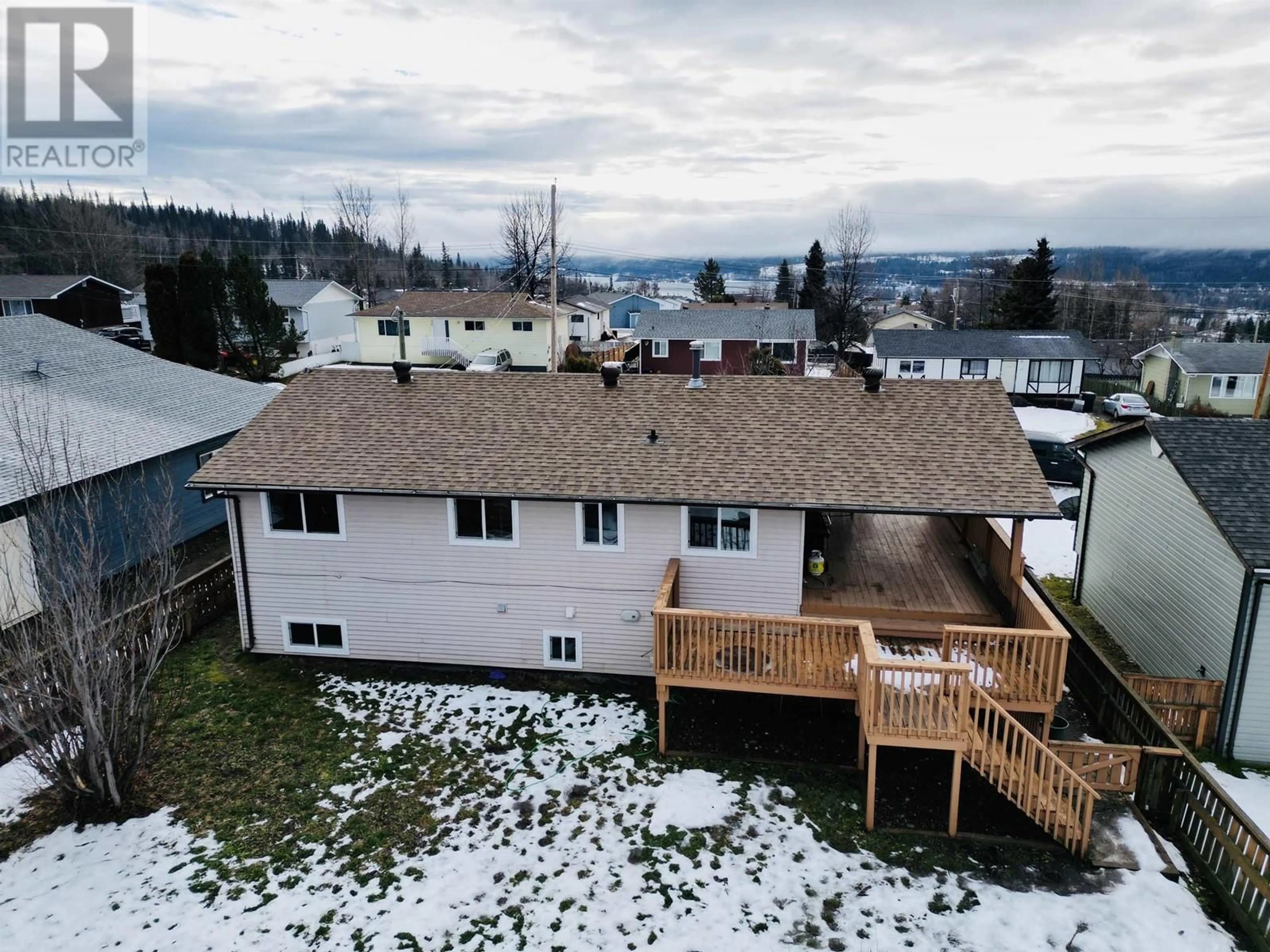 Frontside or backside of a home, the fenced backyard for 417 4TH AVENUE, Burns Lake British Columbia V0J1E0