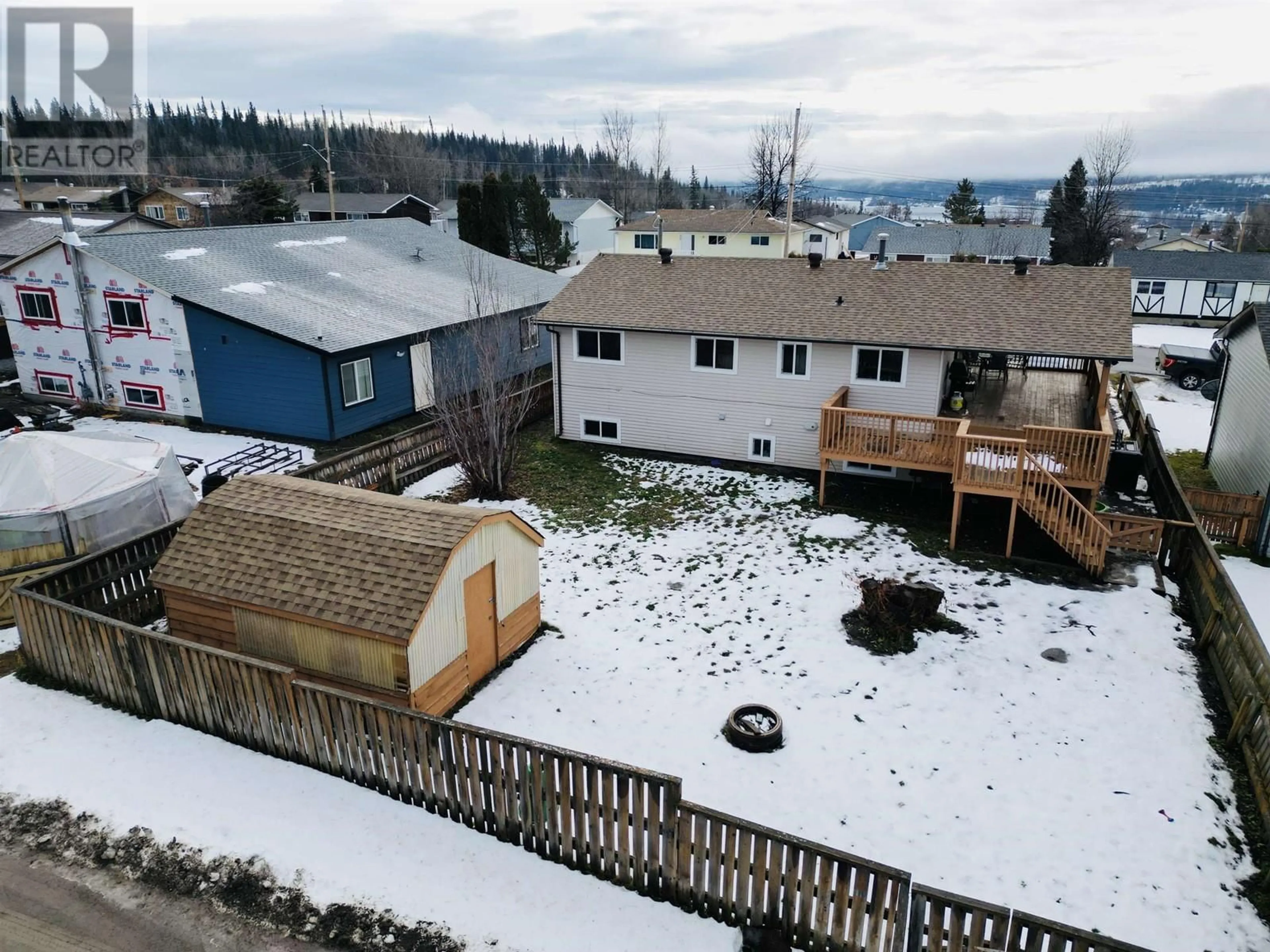 Frontside or backside of a home, the fenced backyard for 417 4TH AVENUE, Burns Lake British Columbia V0J1E0