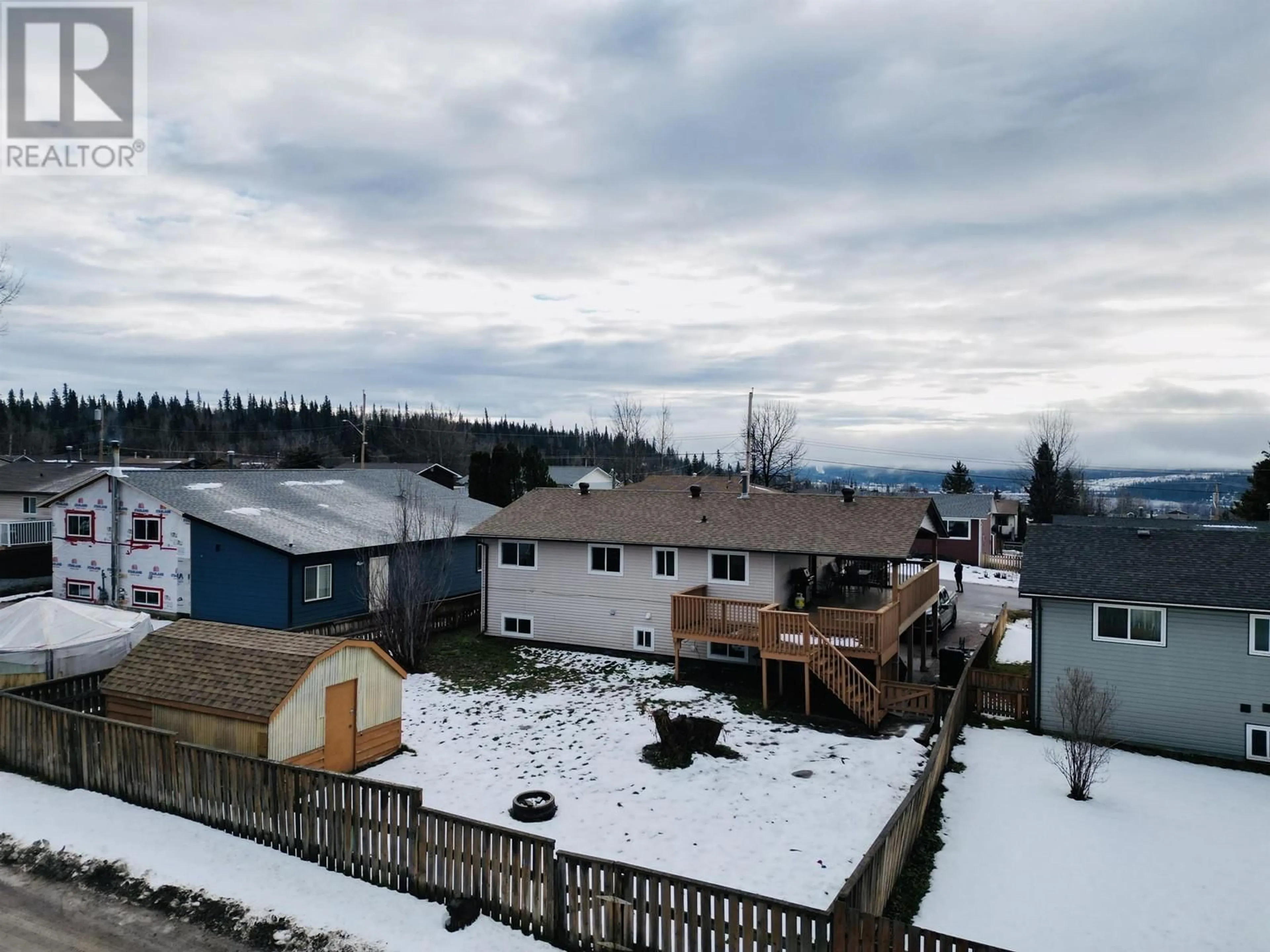 Frontside or backside of a home, the fenced backyard for 417 4TH AVENUE, Burns Lake British Columbia V0J1E0