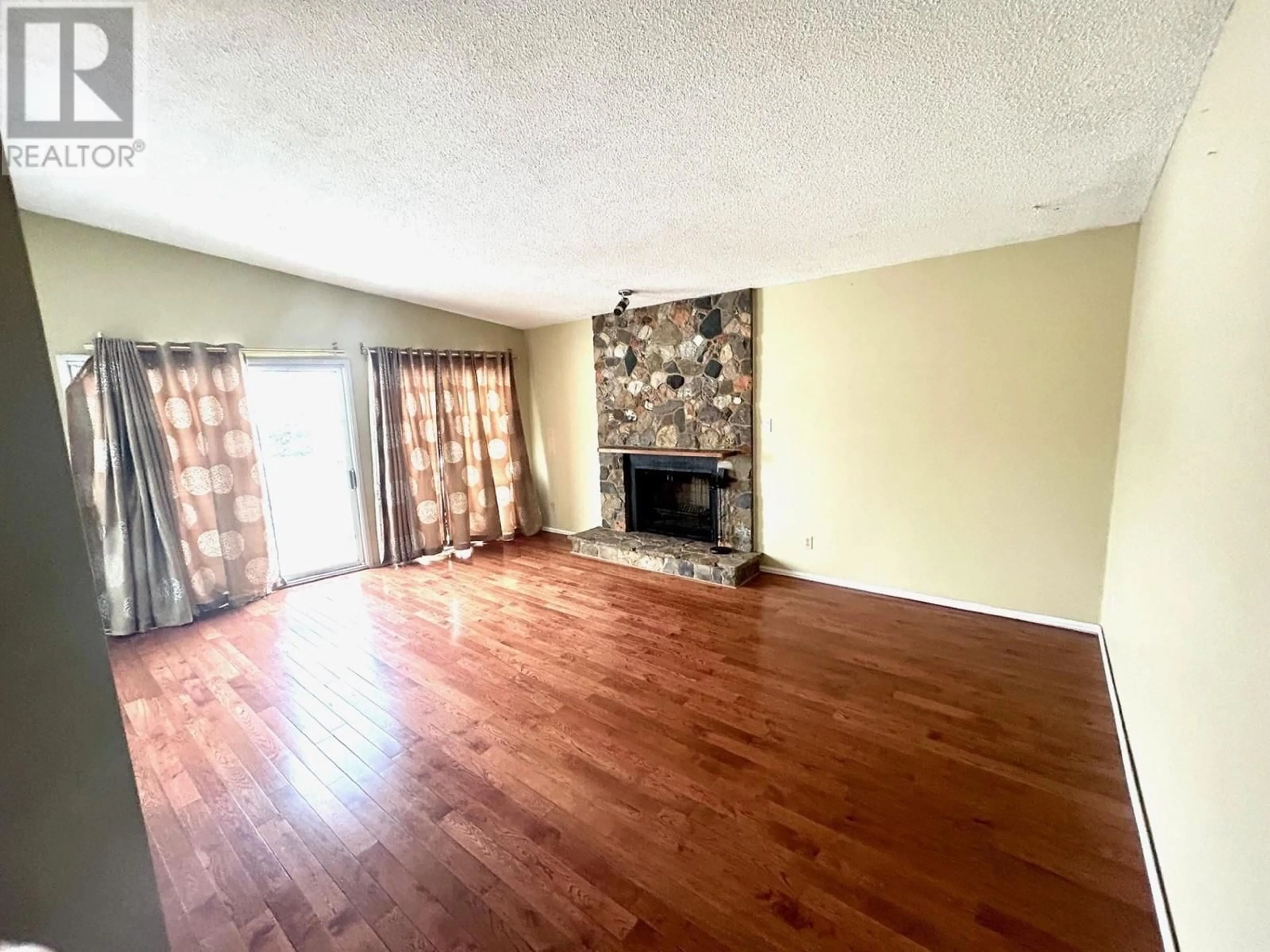 A pic of a room, wood floors for 5017 44 STREET, Fort Nelson British Columbia V0C1R0