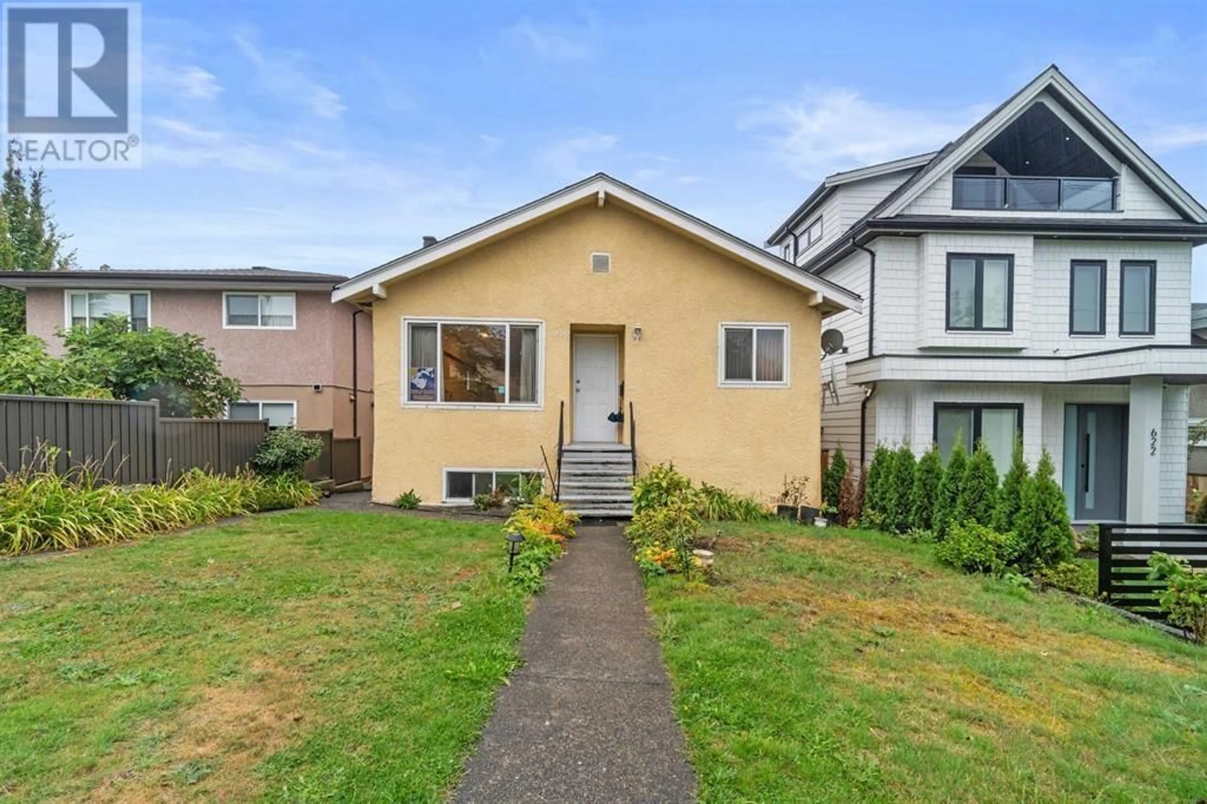 Frontside or backside of a home, the fenced backyard for 620 SLOCAN STREET, Vancouver British Columbia V5K3X7