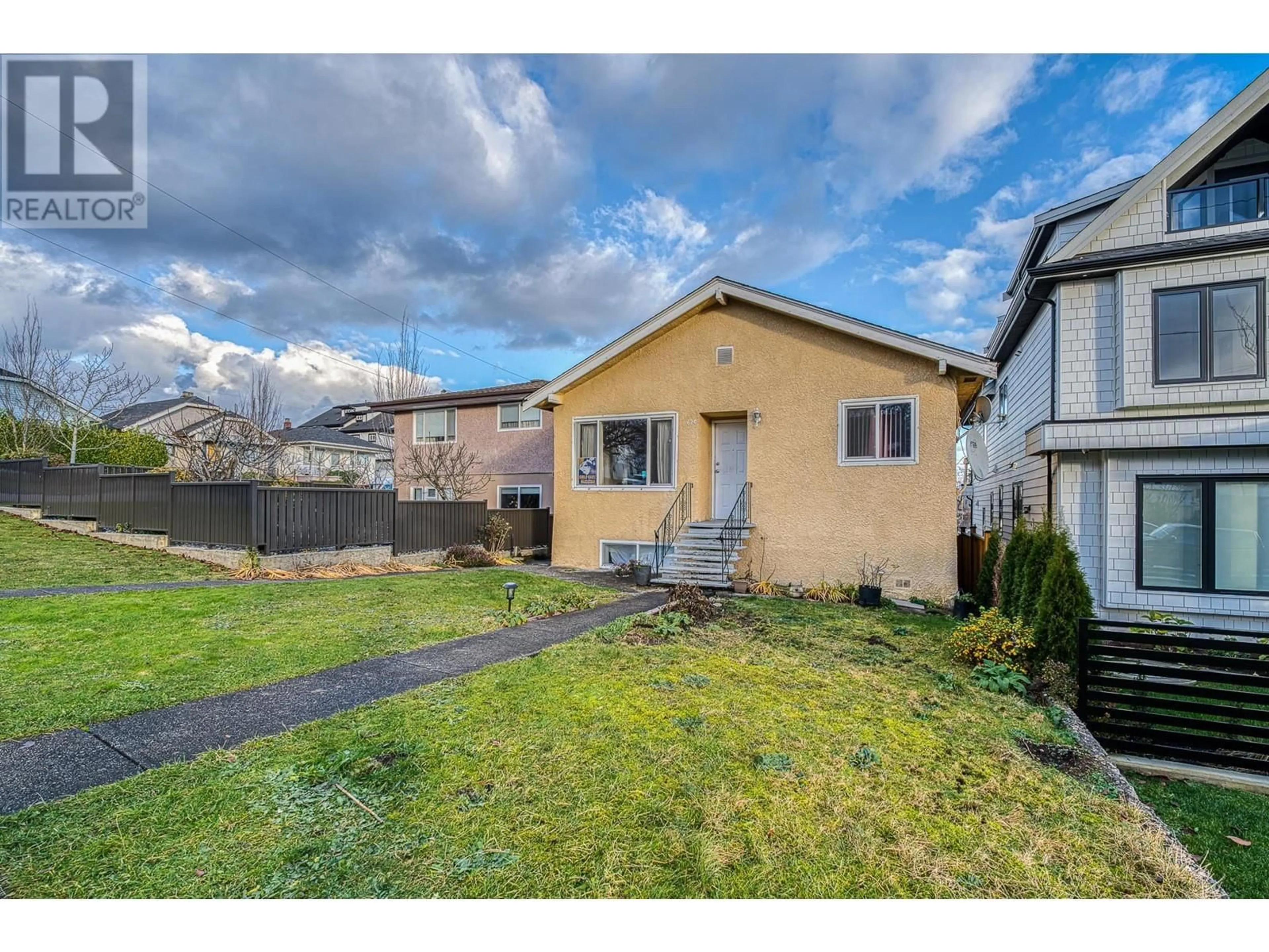 Frontside or backside of a home, the fenced backyard for 620 SLOCAN STREET, Vancouver British Columbia V5K3X7