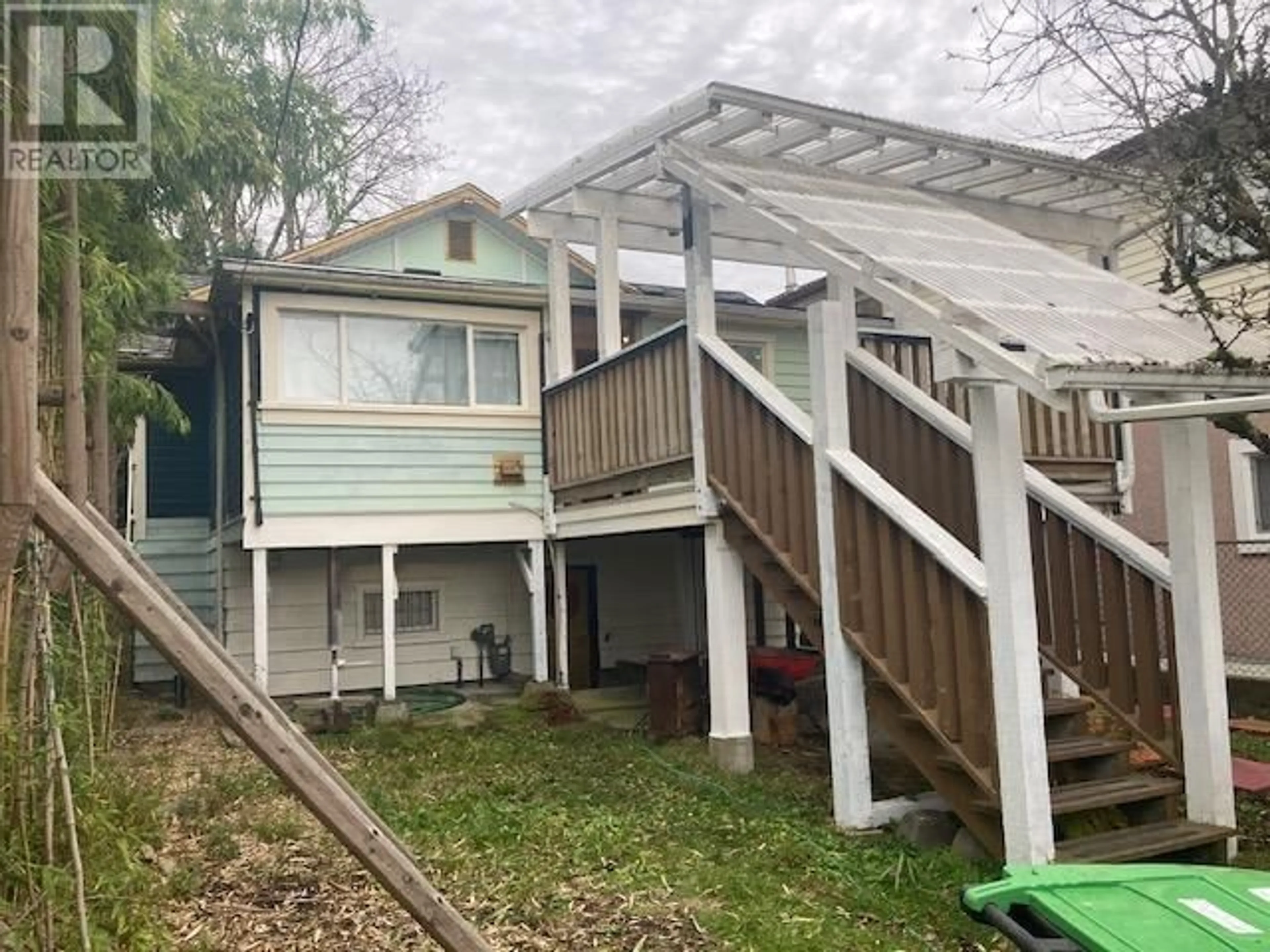 Frontside or backside of a home, the fenced backyard for 3048 E 7TH AVENUE, Vancouver British Columbia V5M1V5