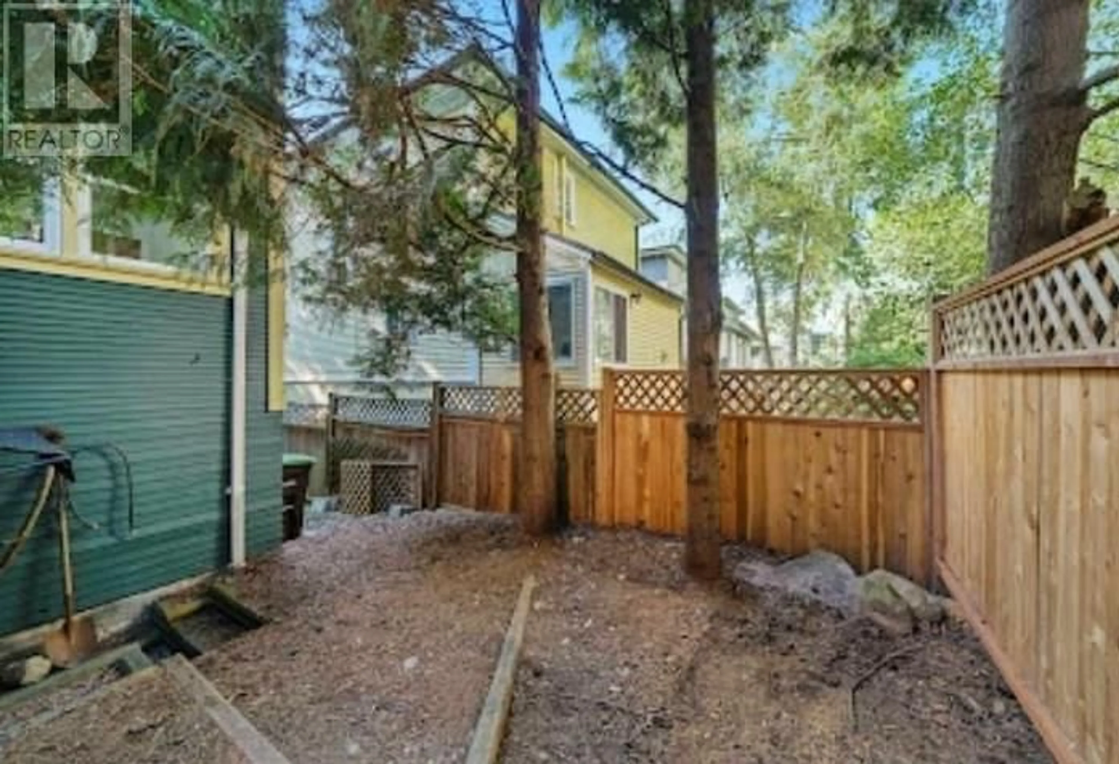 A pic from exterior of the house or condo, the fenced backyard for 1620 MCLEAN DRIVE, Vancouver British Columbia V5L3P3