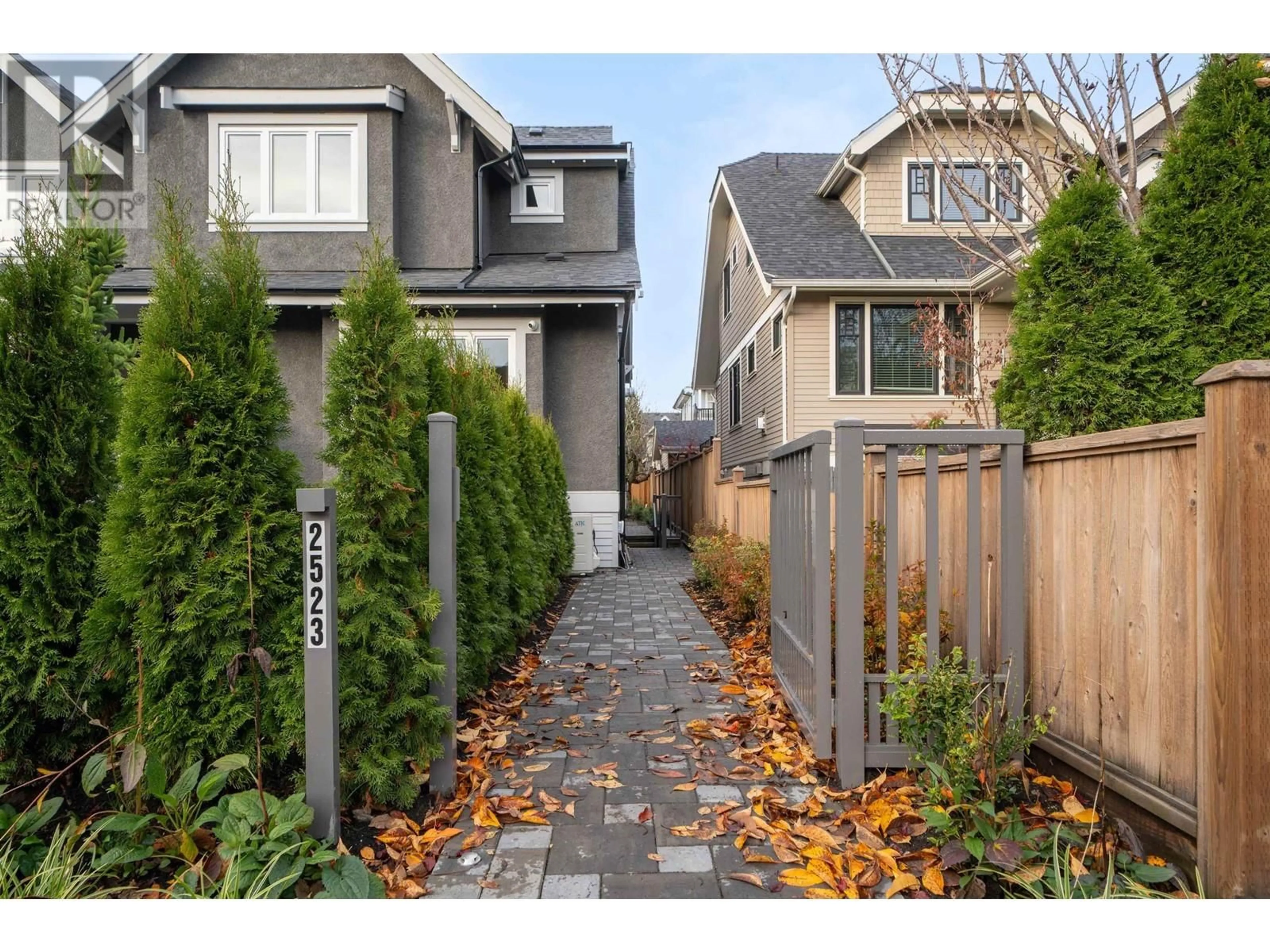 Frontside or backside of a home, the fenced backyard for 2523 W 8TH AVENUE, Vancouver British Columbia V6K2B3