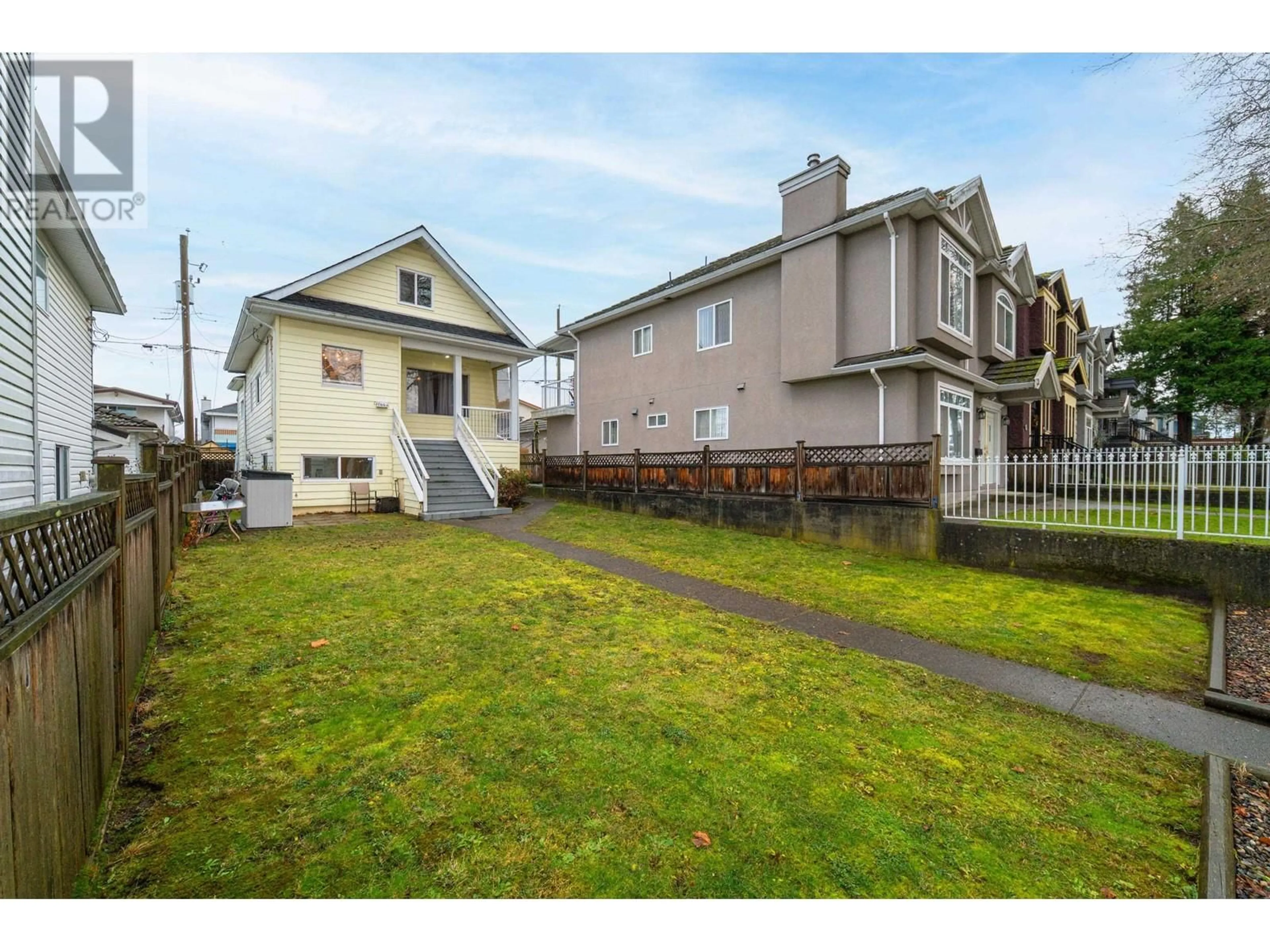 Frontside or backside of a home, the fenced backyard for 1865 E 53RD AVENUE, Vancouver British Columbia V5P1X5