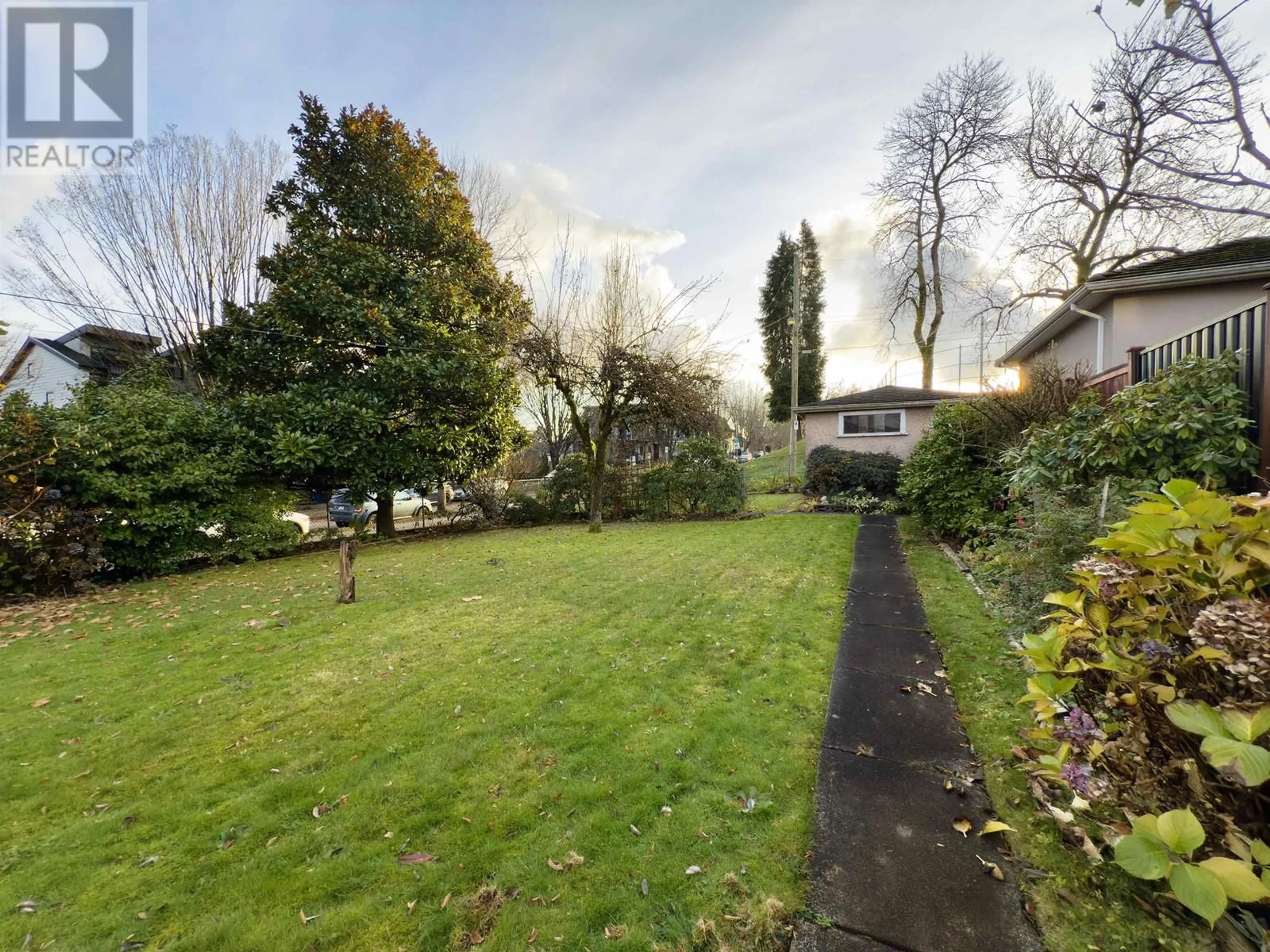 Frontside or backside of a home, the fenced backyard for 2770 EUCLID AVENUE, Vancouver British Columbia V5R5B9