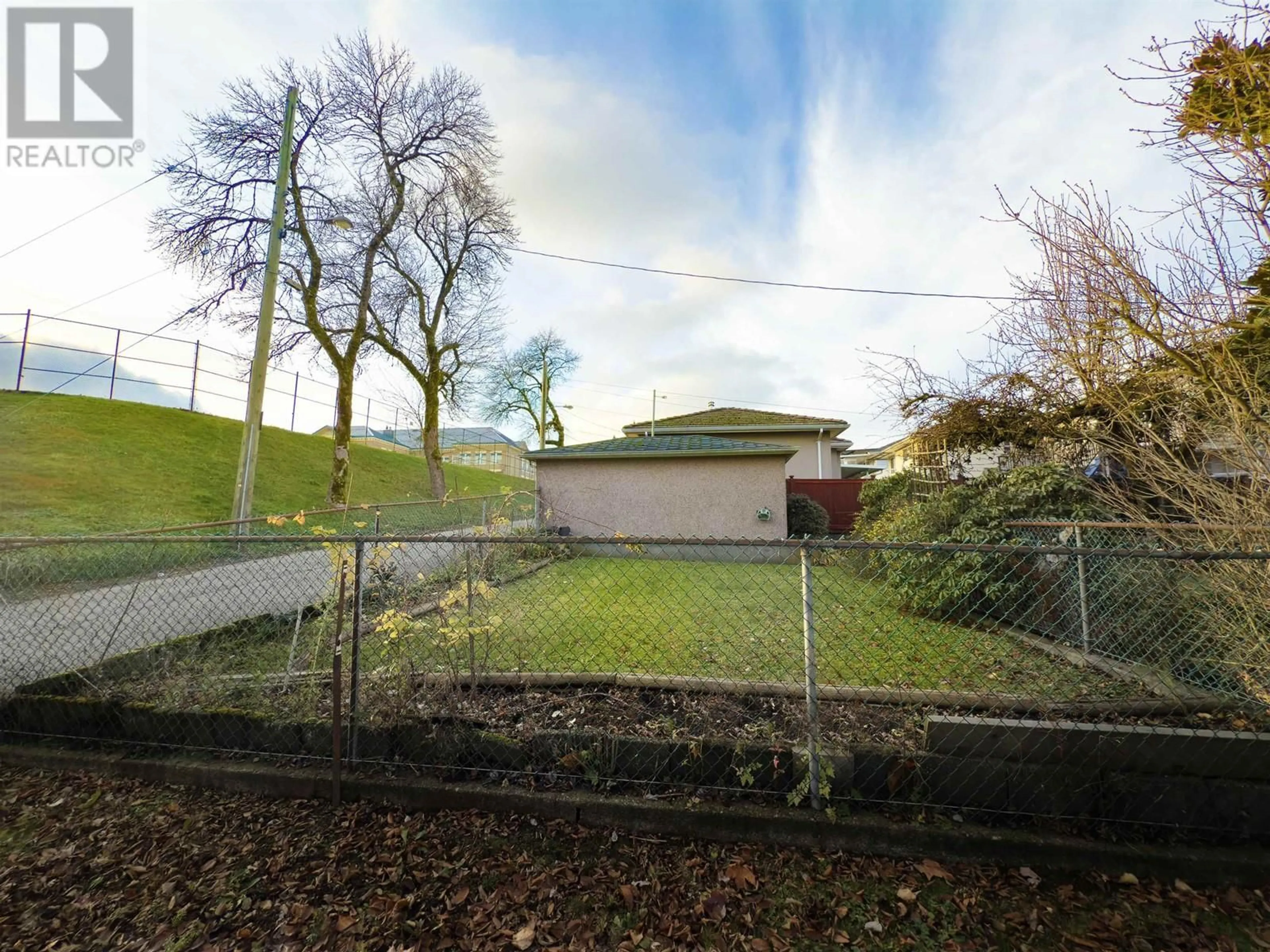 Frontside or backside of a home, the fenced backyard for 2770 EUCLID AVENUE, Vancouver British Columbia V5R5B9