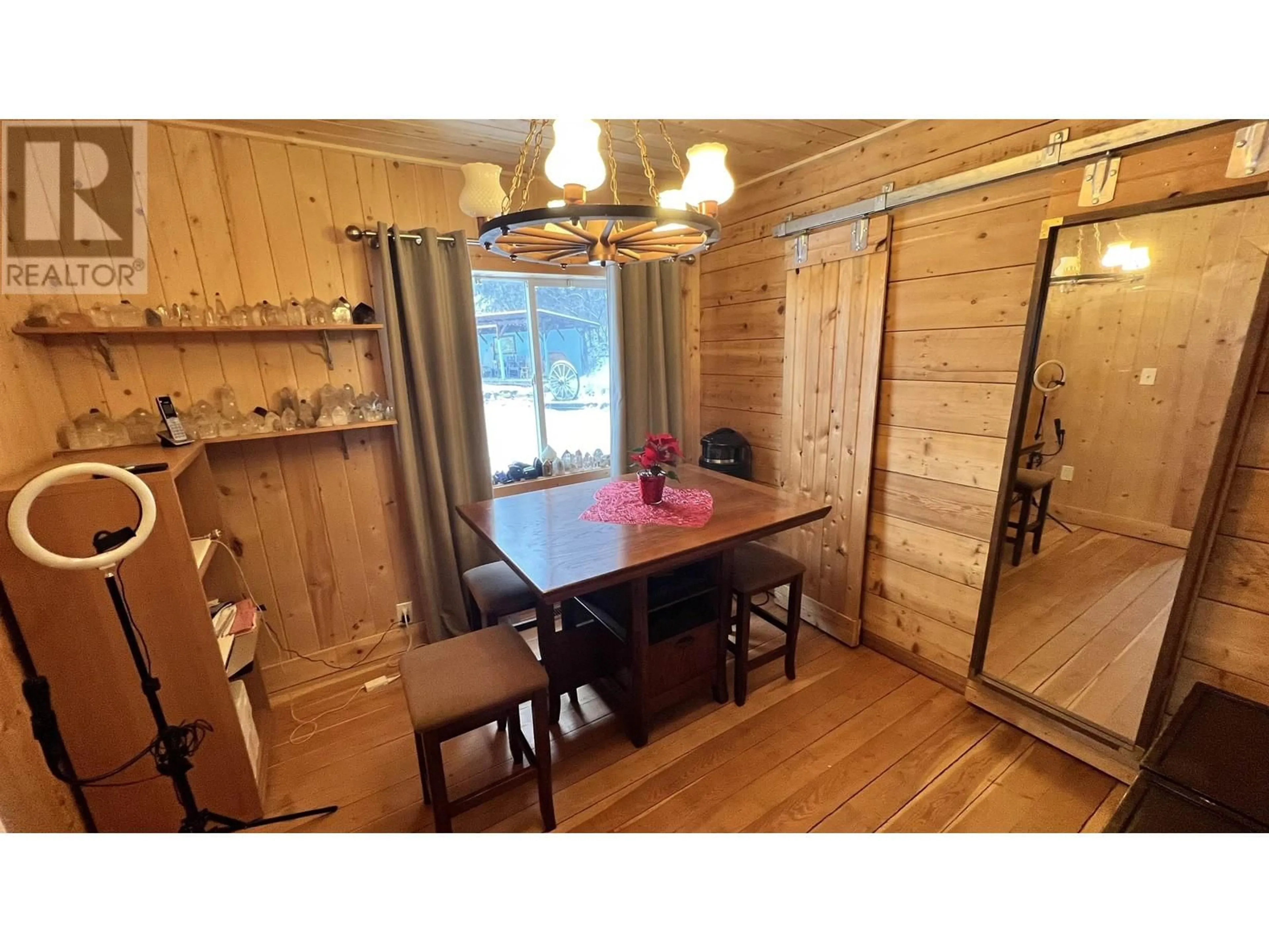 Dining room, wood/laminate floor for 6831 SODA CREEK ROAD, McLeese Lake British Columbia V0L1P0
