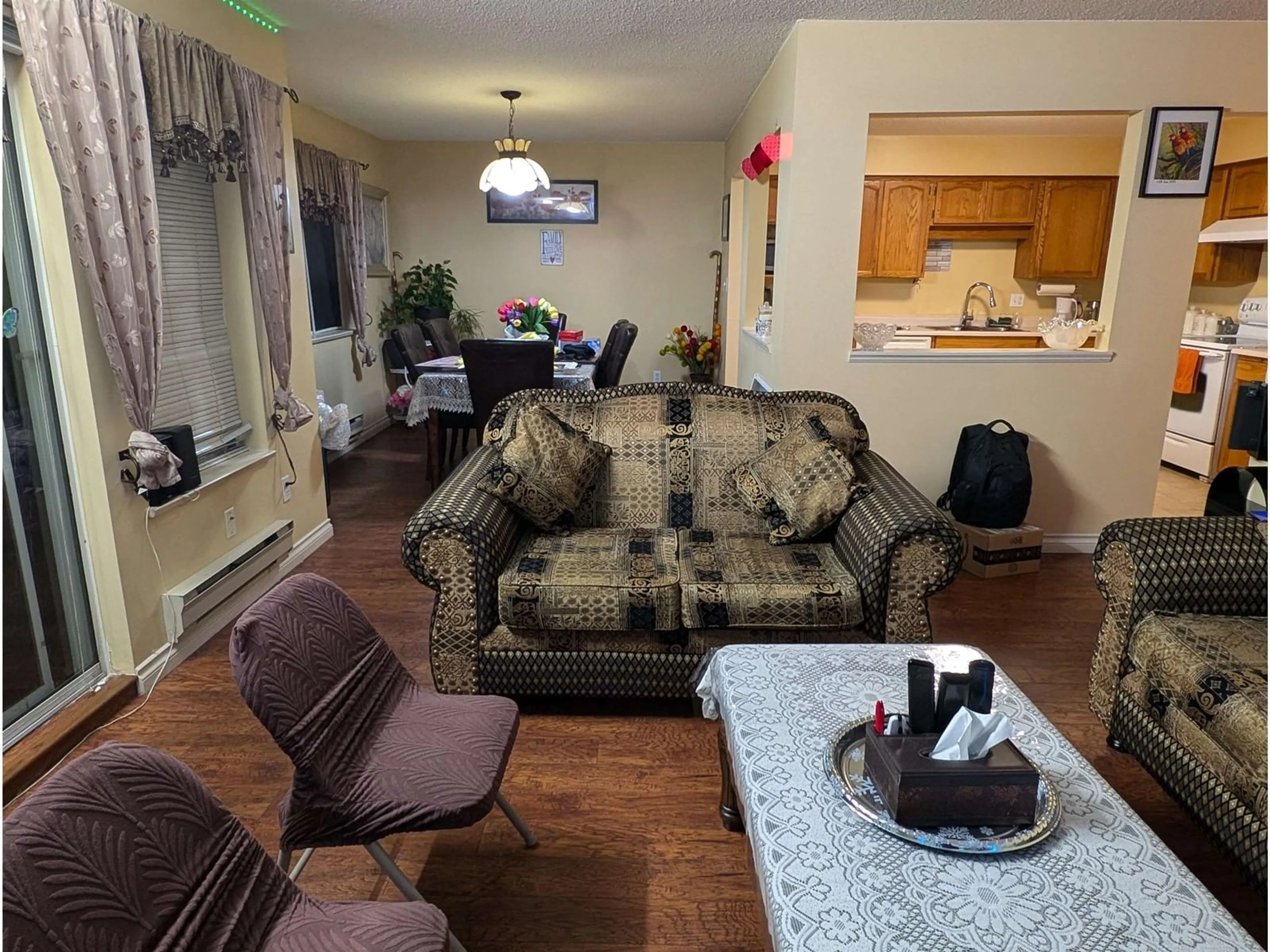 Living room with furniture, wood/laminate floor for 315 33090 GEORGE FERGUSON WAY, Abbotsford British Columbia V2S6Y2