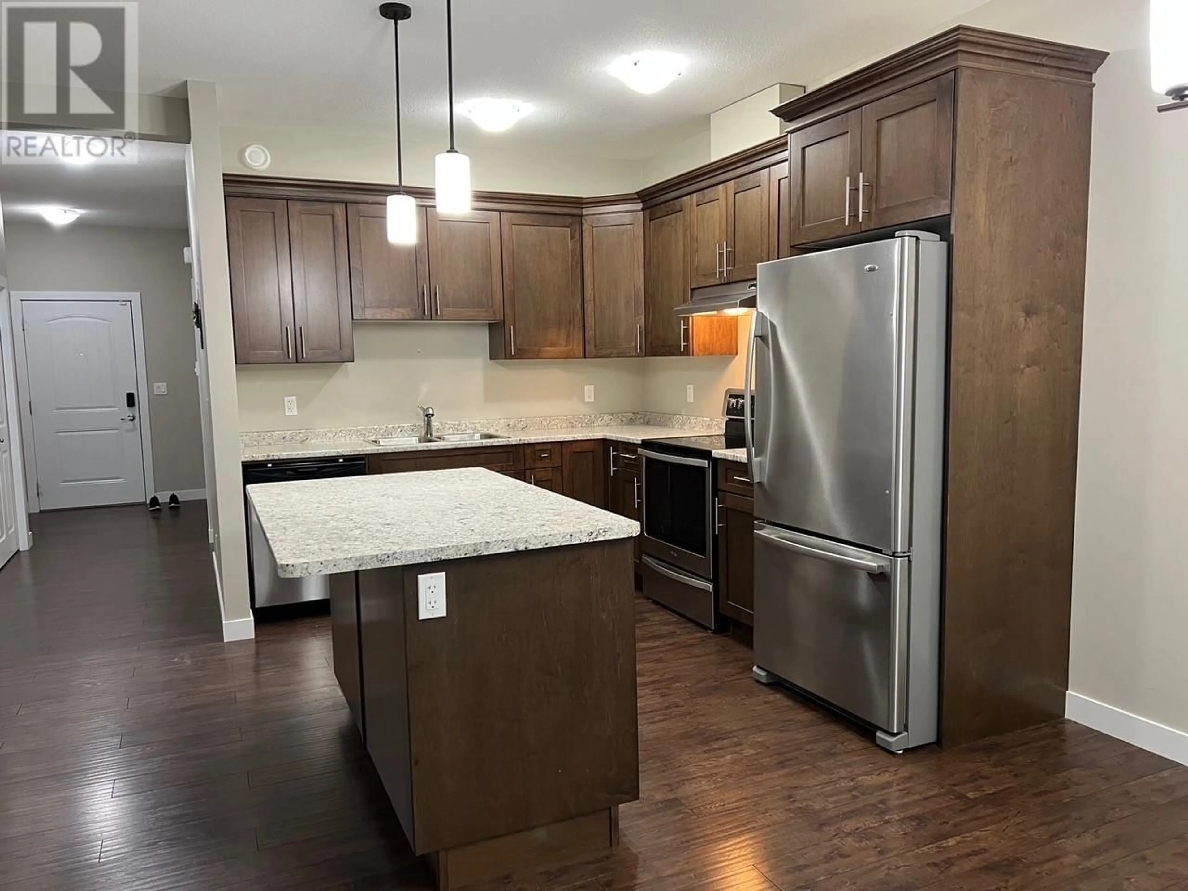 Open concept kitchen, wood/laminate floor for 23 9707 99 AVENUE, Taylor British Columbia V0C2K0