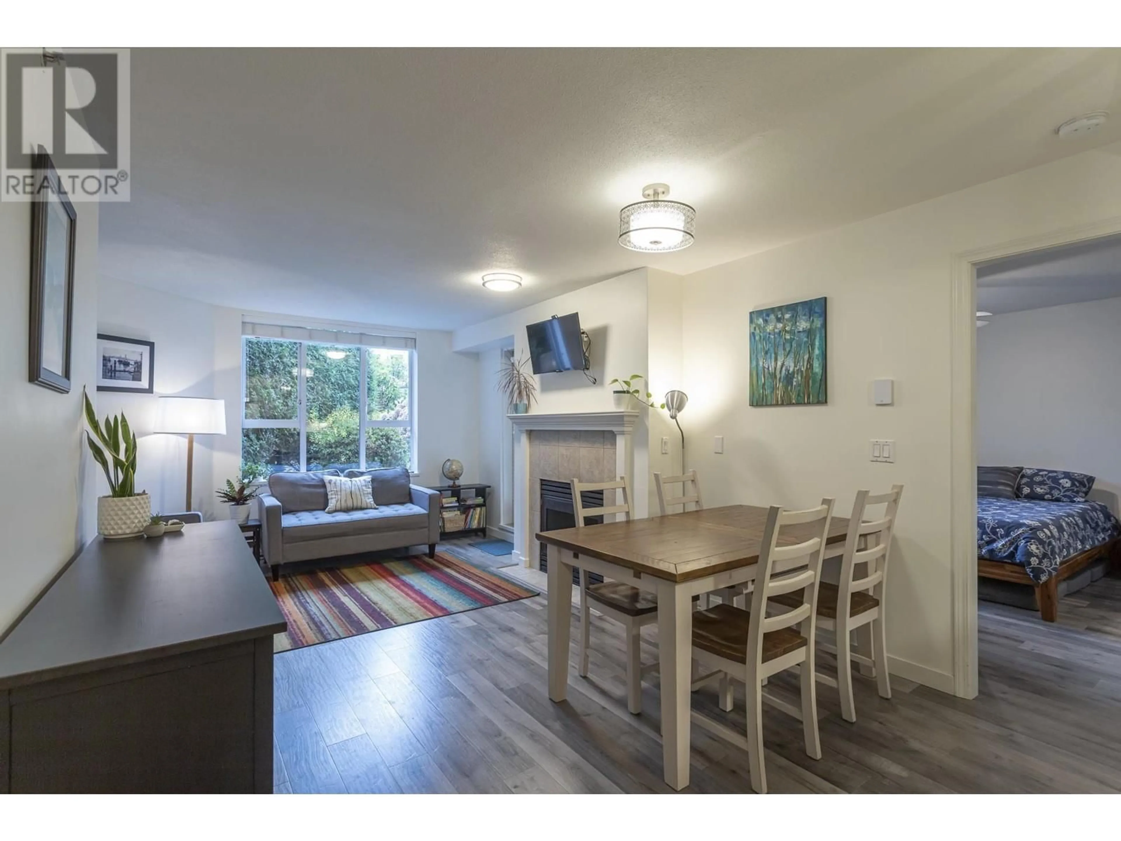 Living room, wood floors for 107 3608 DEERCREST DRIVE, North Vancouver British Columbia V7G2S8