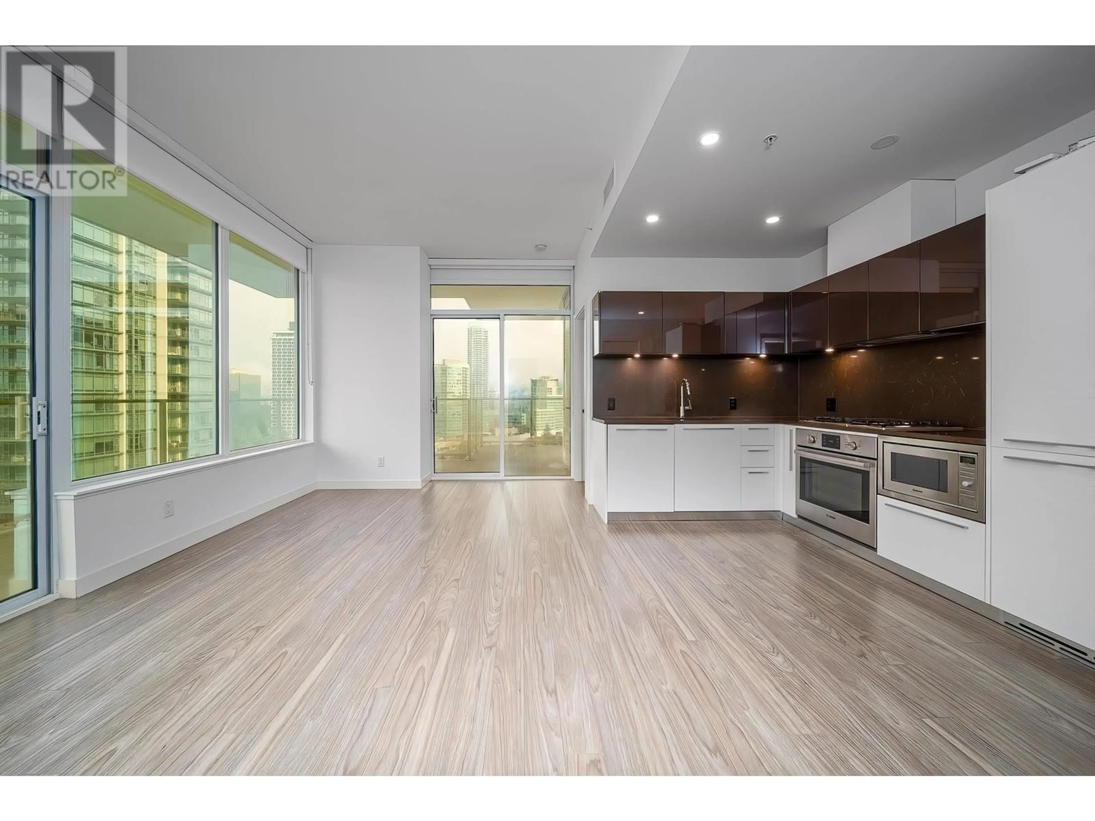 Open concept kitchen, wood/laminate floor for 1301 6288 CASSIE AVENUE, Burnaby British Columbia V5H0H7