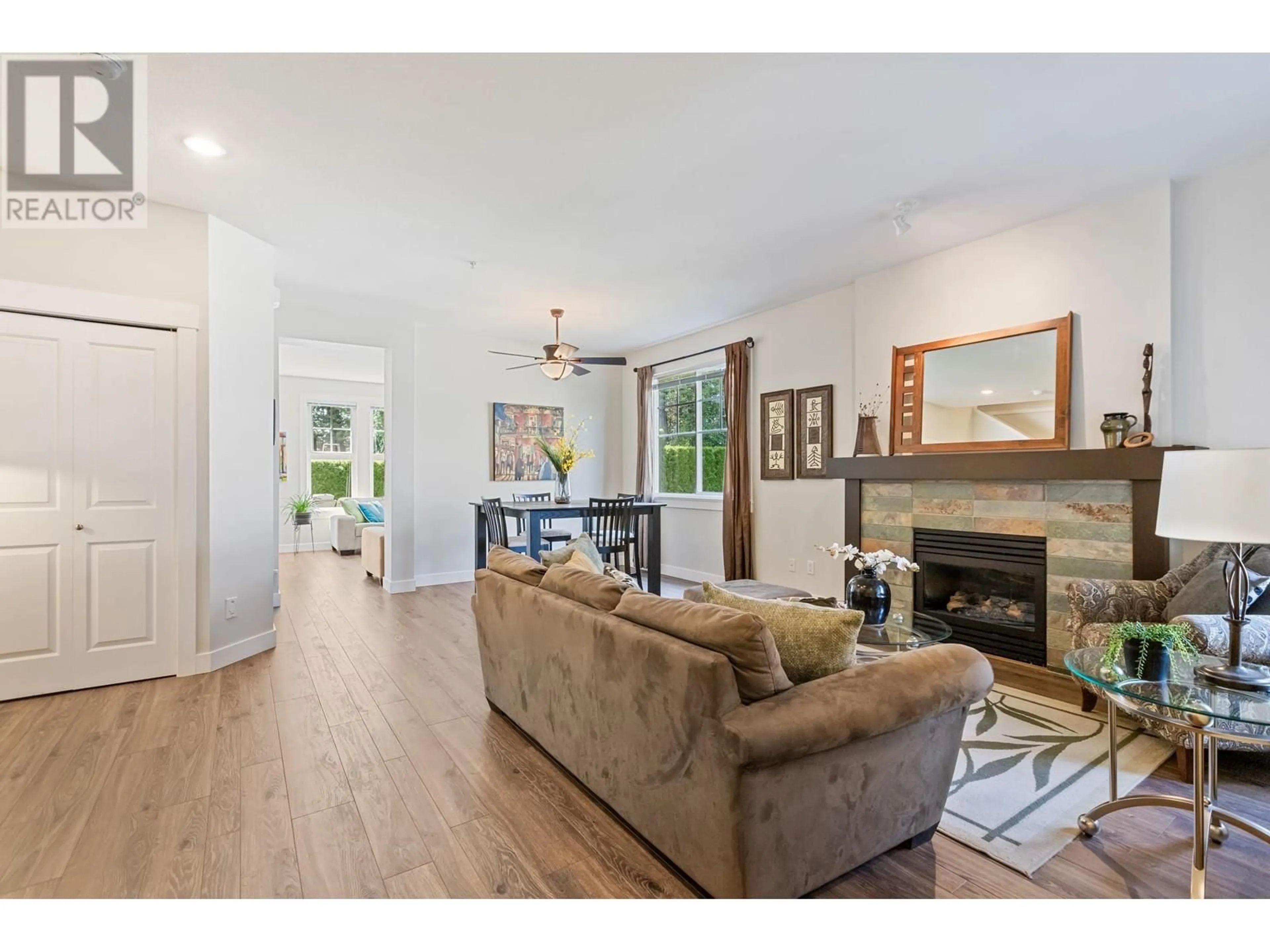 Living room with furniture, wood/laminate floor for 67 19452 FRASER WAY, Pitt Meadows British Columbia V3Y0A3