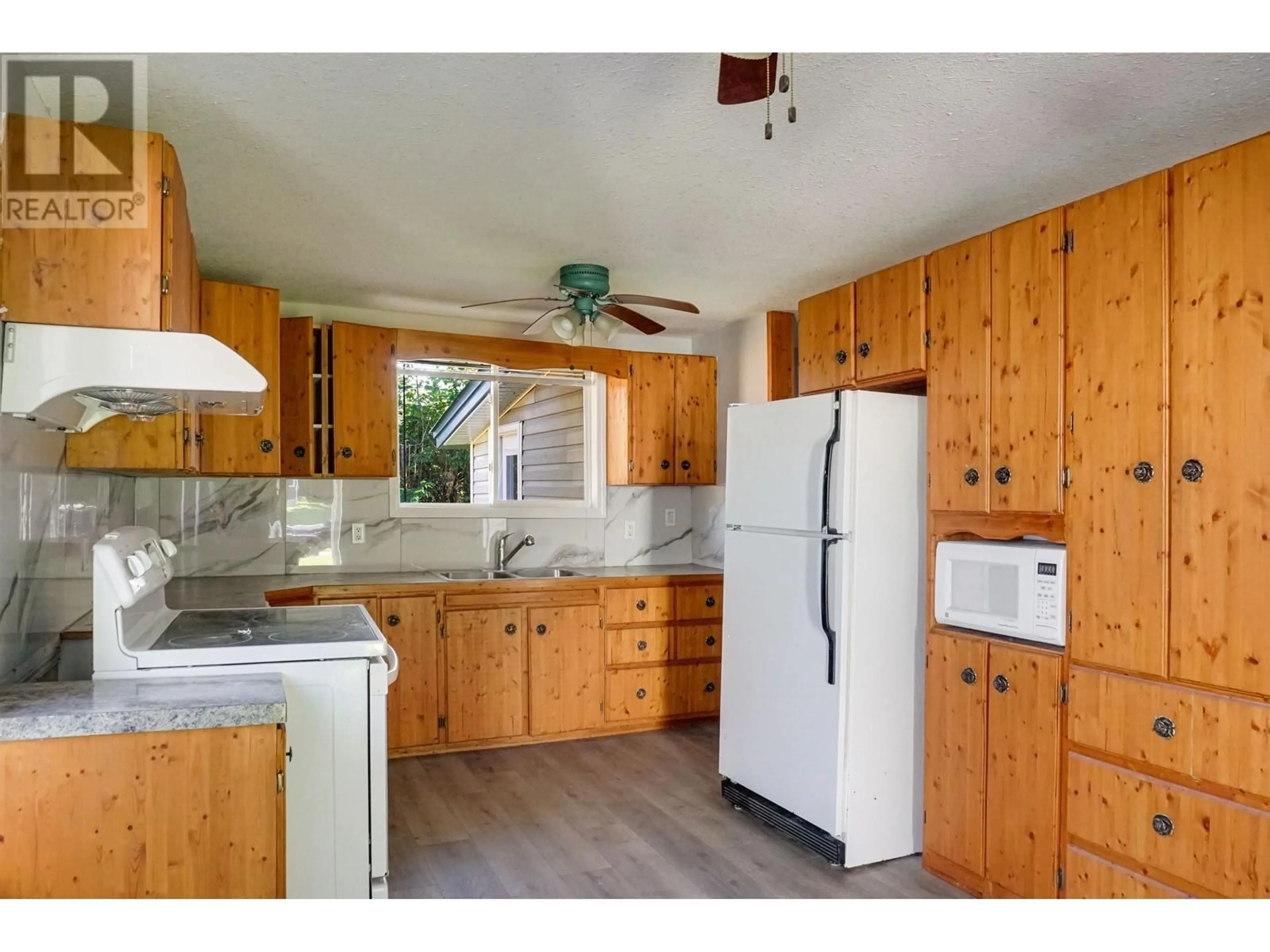 Standard kitchen, wood/laminate floor for 15 SAGUENAY STREET, Kitimat British Columbia V8C1W7