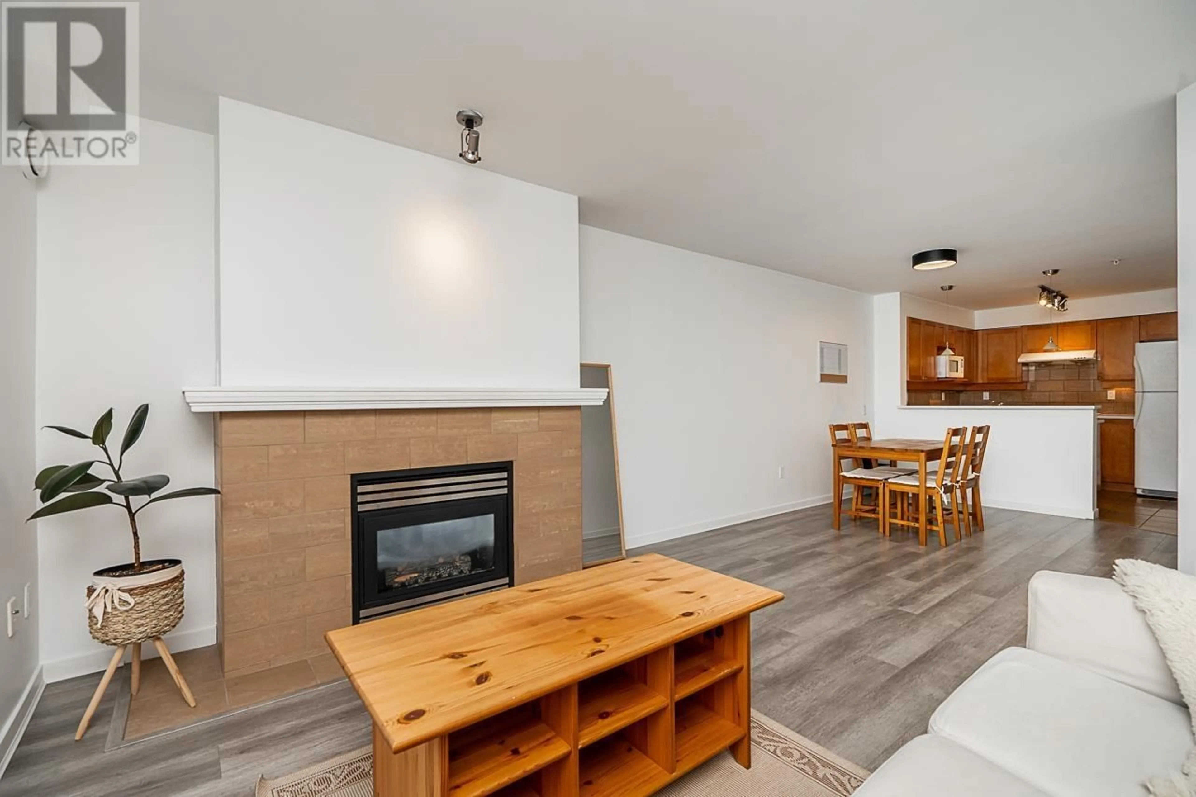 Living room with furniture, wood/laminate floor for 306 3580 W 41ST AVENUE, Vancouver British Columbia V6N3E6