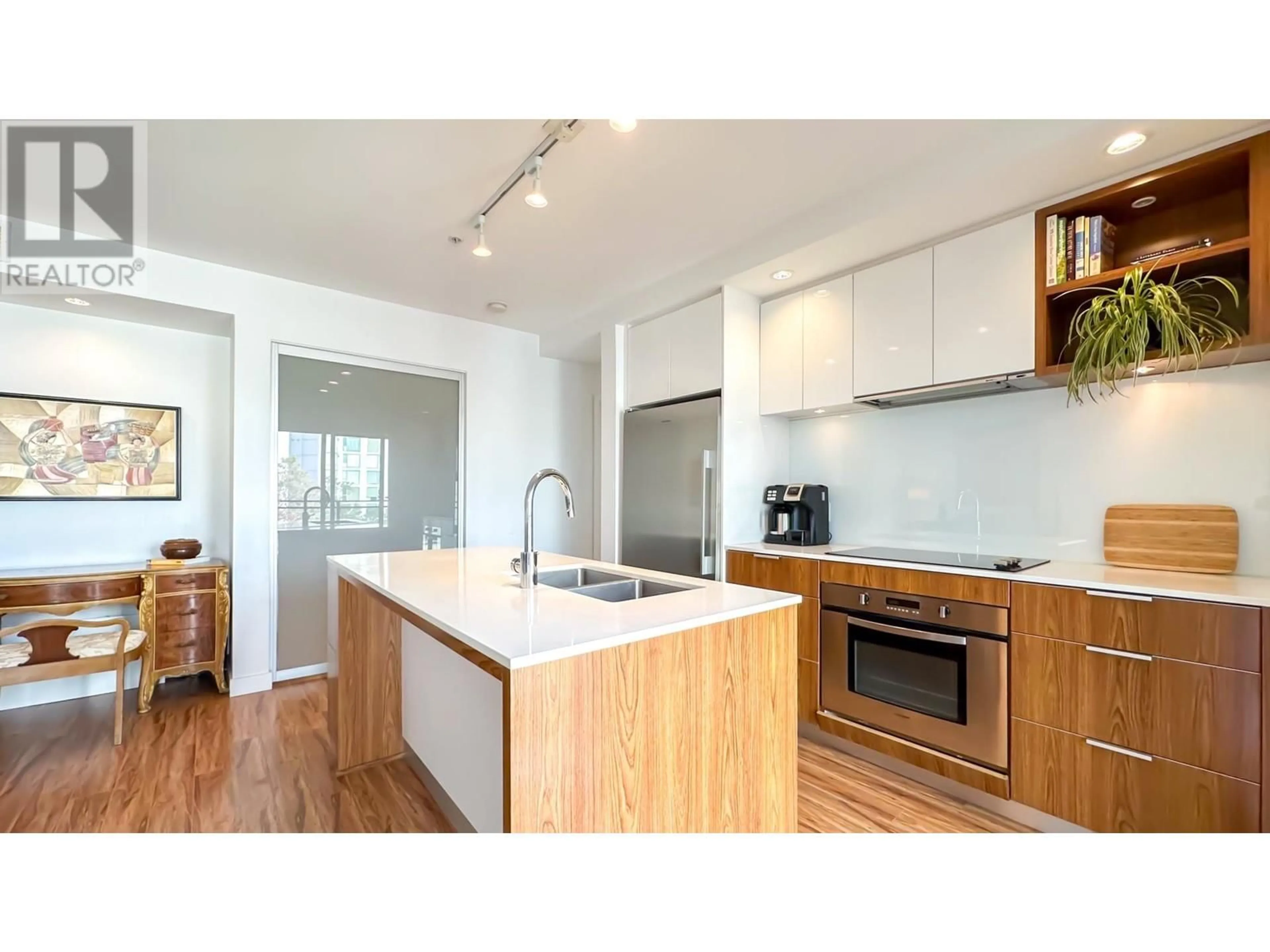 Open concept kitchen, wood/laminate floor for 311 111 E 3RD STREET, North Vancouver British Columbia V7L0C6