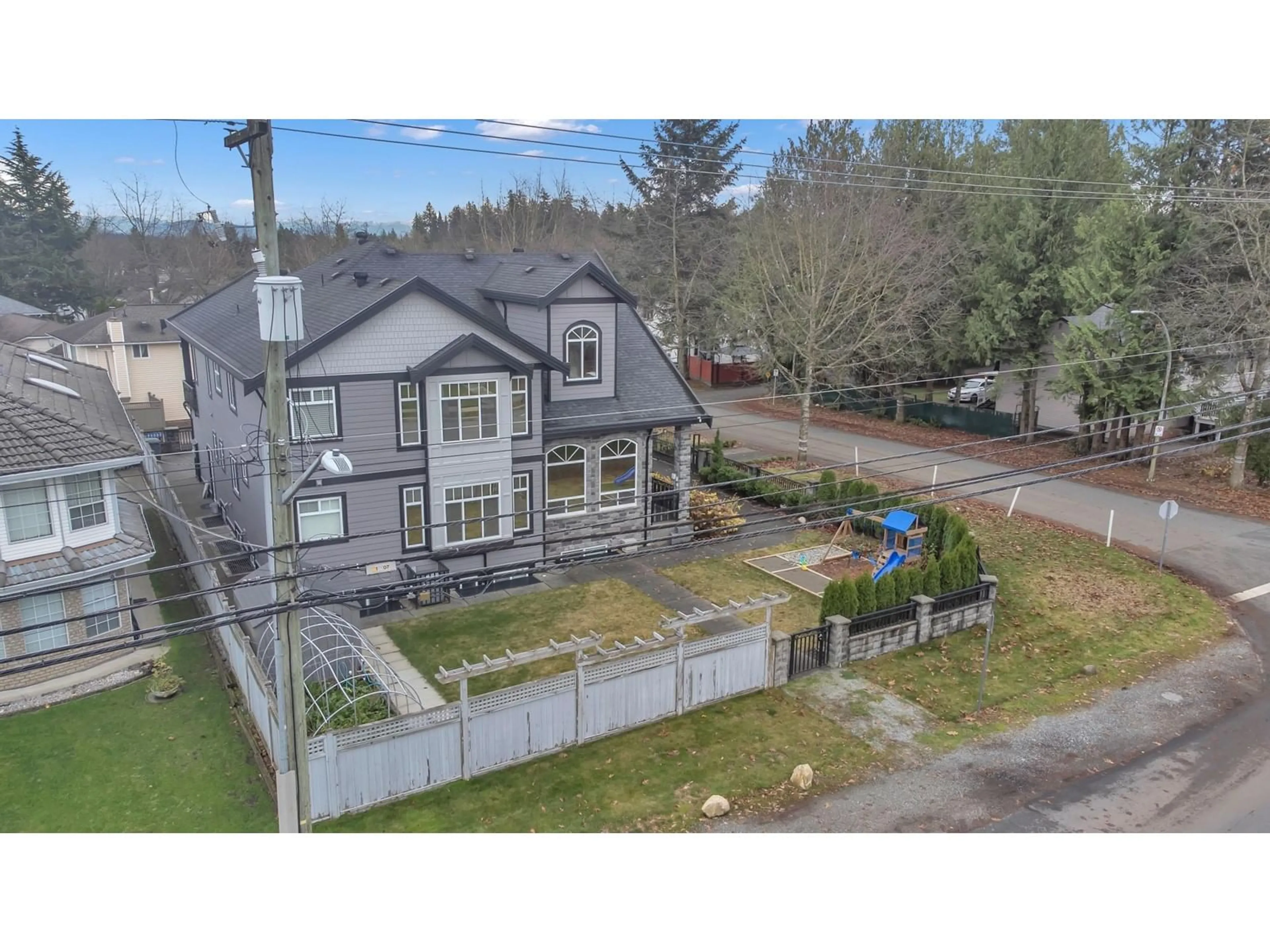 A pic from outside/outdoor area/front of a property/back of a property/a pic from drone, street for 15615 94A AVENUE, Surrey British Columbia V4N3B5