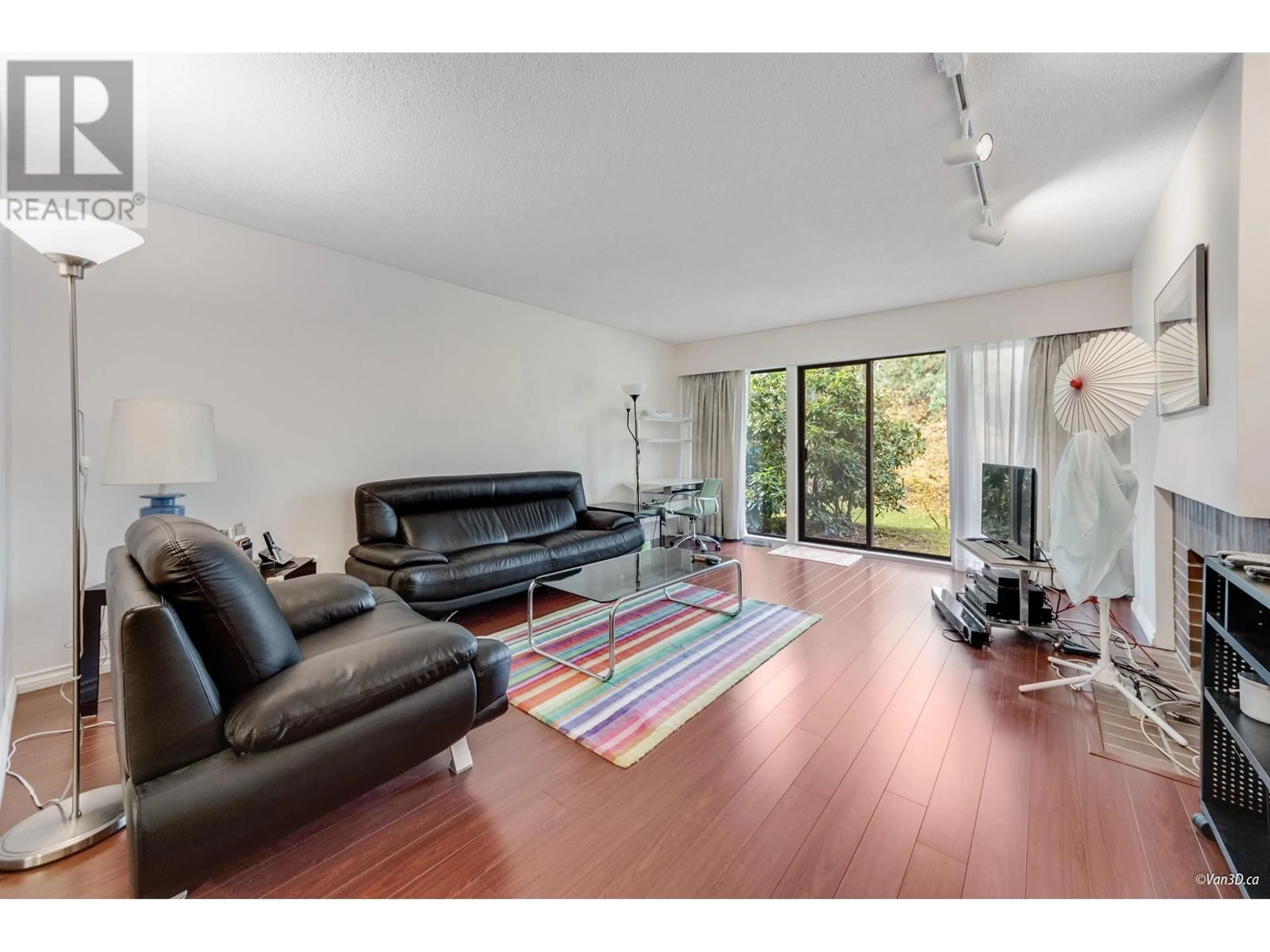 Living room with furniture, wood/laminate floor for 4115 VINE STREET, Vancouver British Columbia V6L3C1