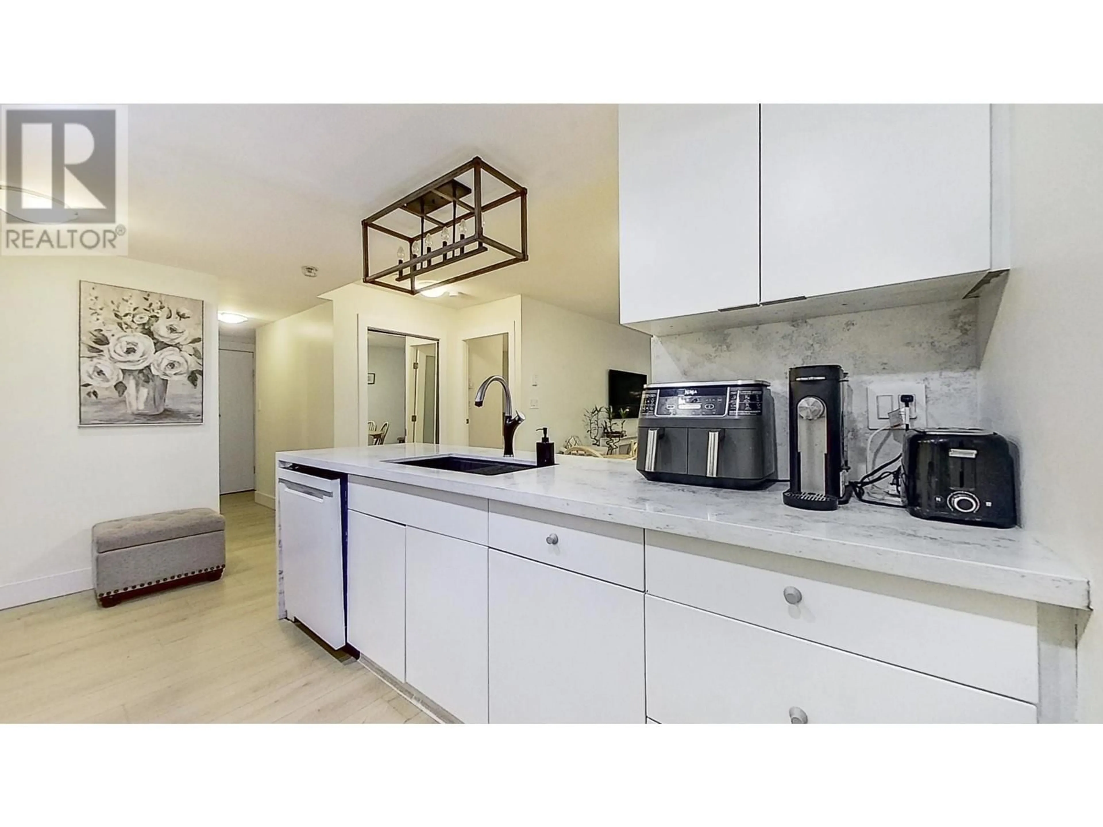 Open concept kitchen, ceramic/tile floor for 202 1033 MARINASIDE CRESCENT, Vancouver British Columbia V6Z3A3