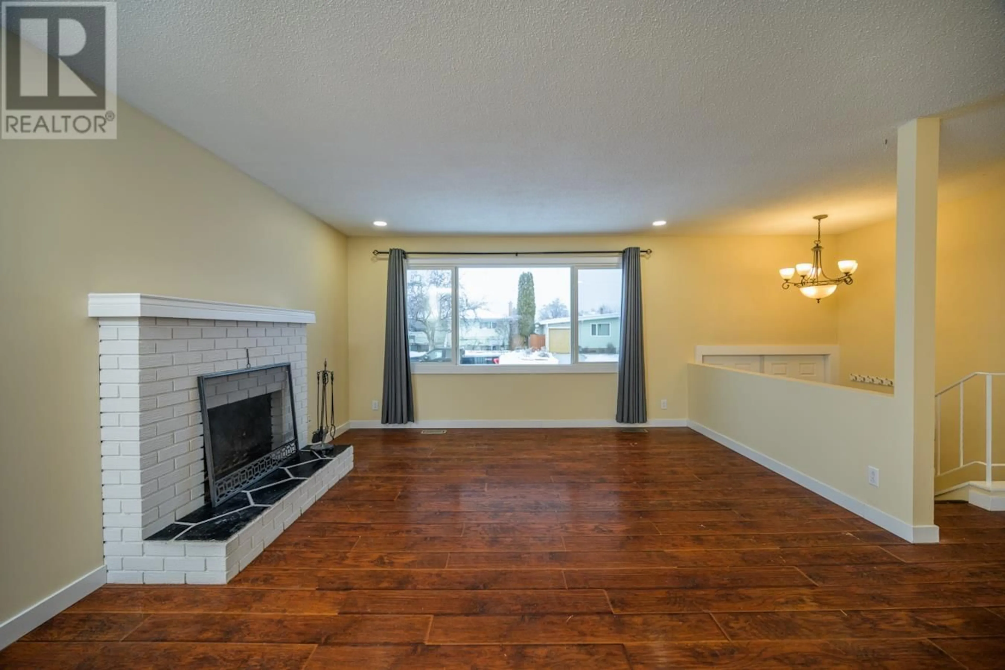 Living room with furniture, wood/laminate floor for 757 YOUNGS AVENUE, Prince George British Columbia V2M3V5