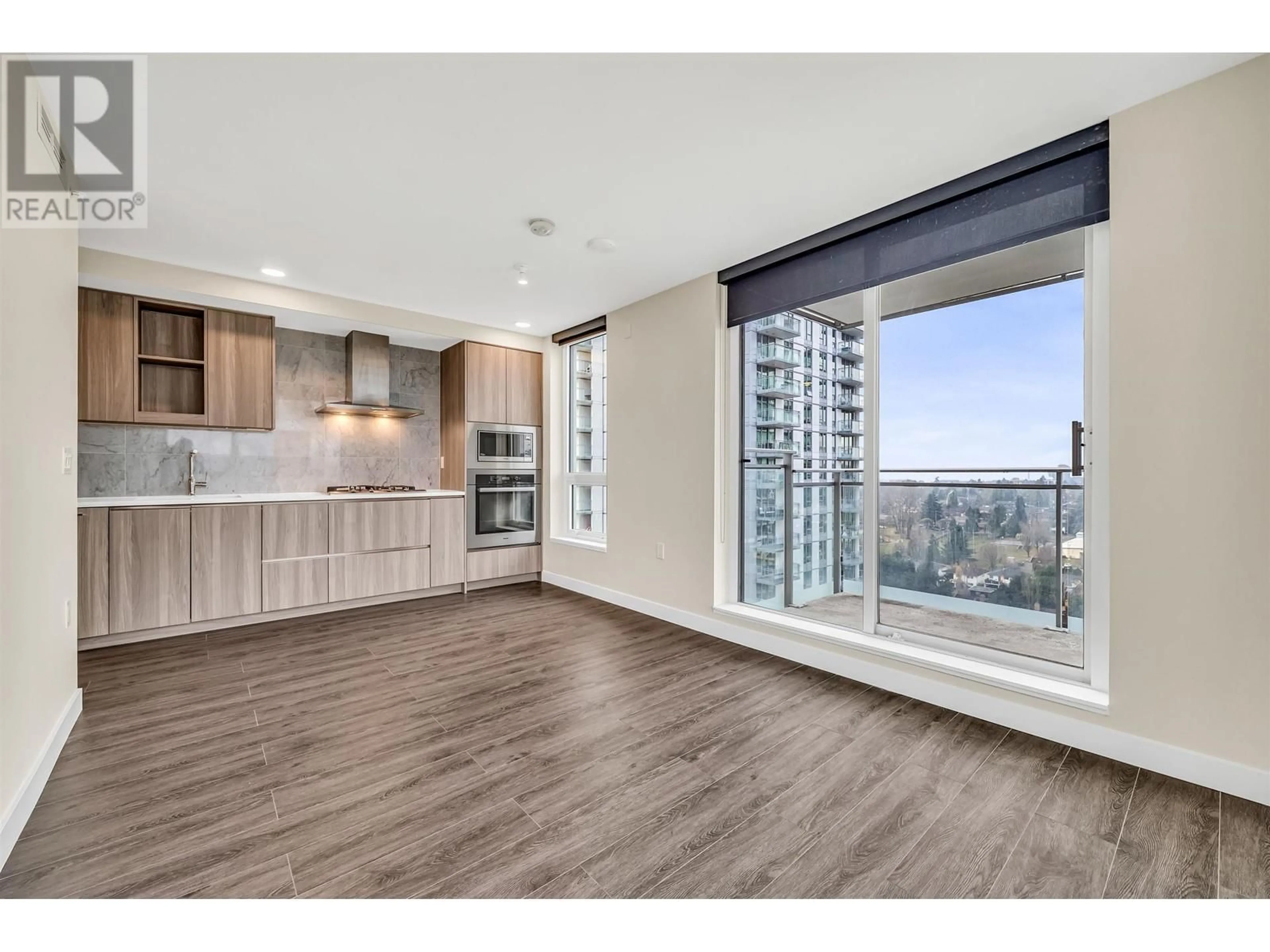 Open concept kitchen, wood/laminate floor for 2201 433 SW MARINE DRIVE, Vancouver British Columbia V5X0H5