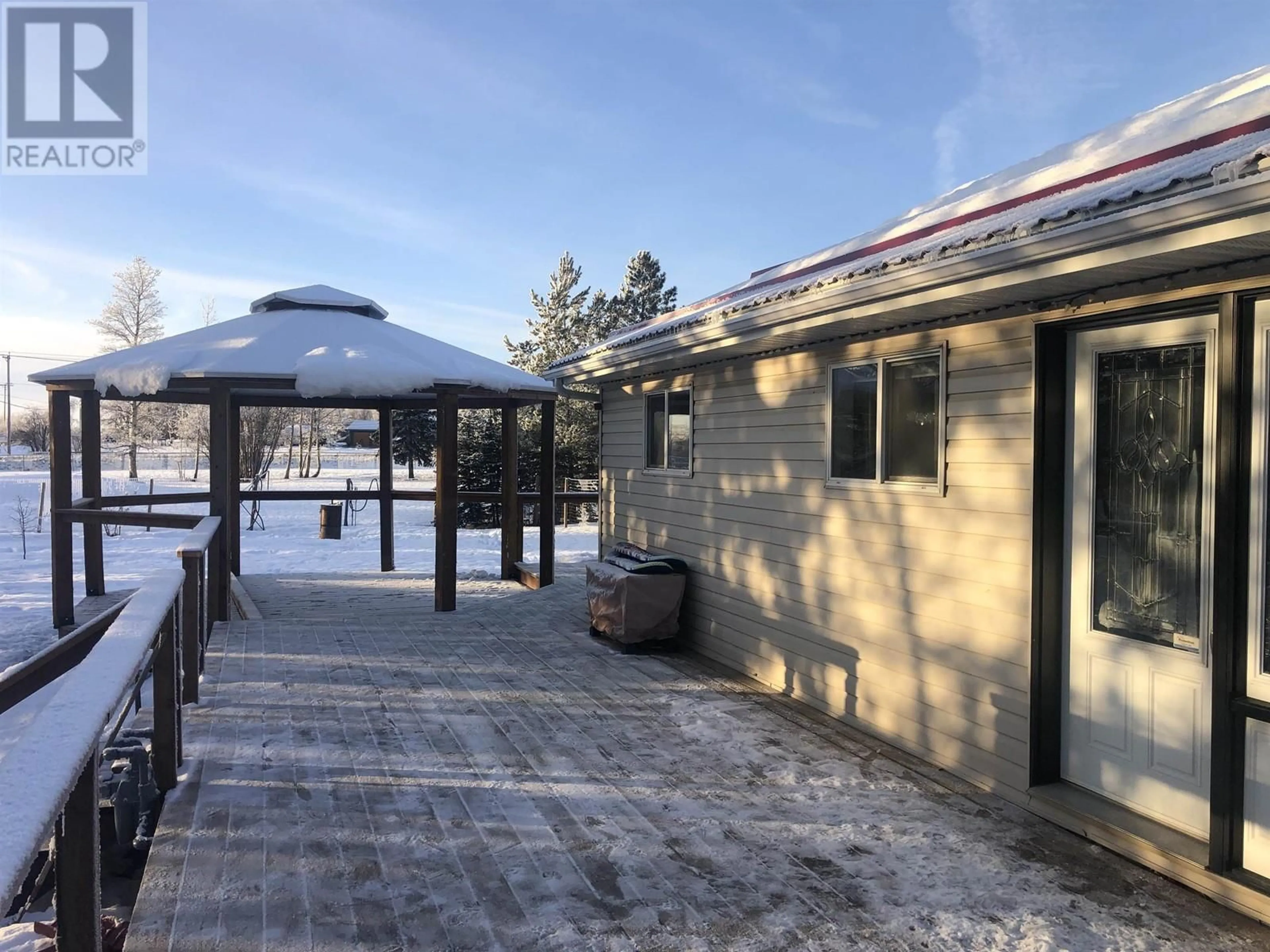 A pic from outside/outdoor area/front of a property/back of a property/a pic from drone, water/lake/river/ocean view for 12286 242 ROAD, Fort St. John British Columbia V1J8A8