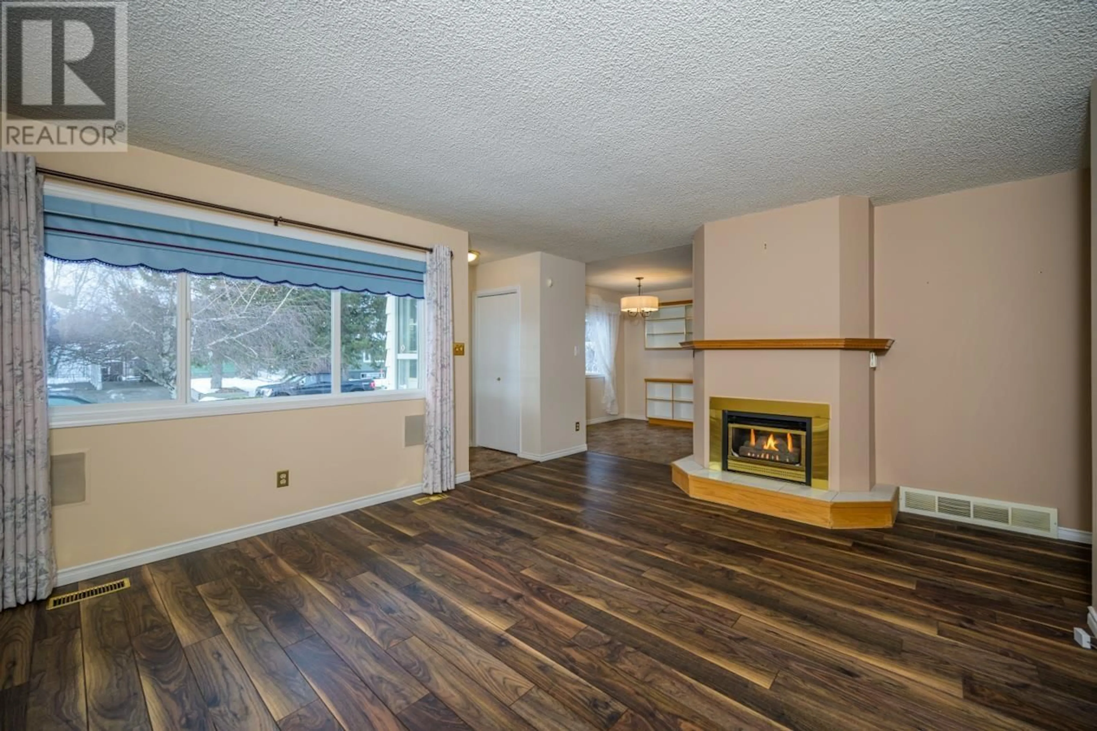 Living room with furniture, wood/laminate floor for 7624 MONCTON CRESCENT, Prince George British Columbia V2N3M1