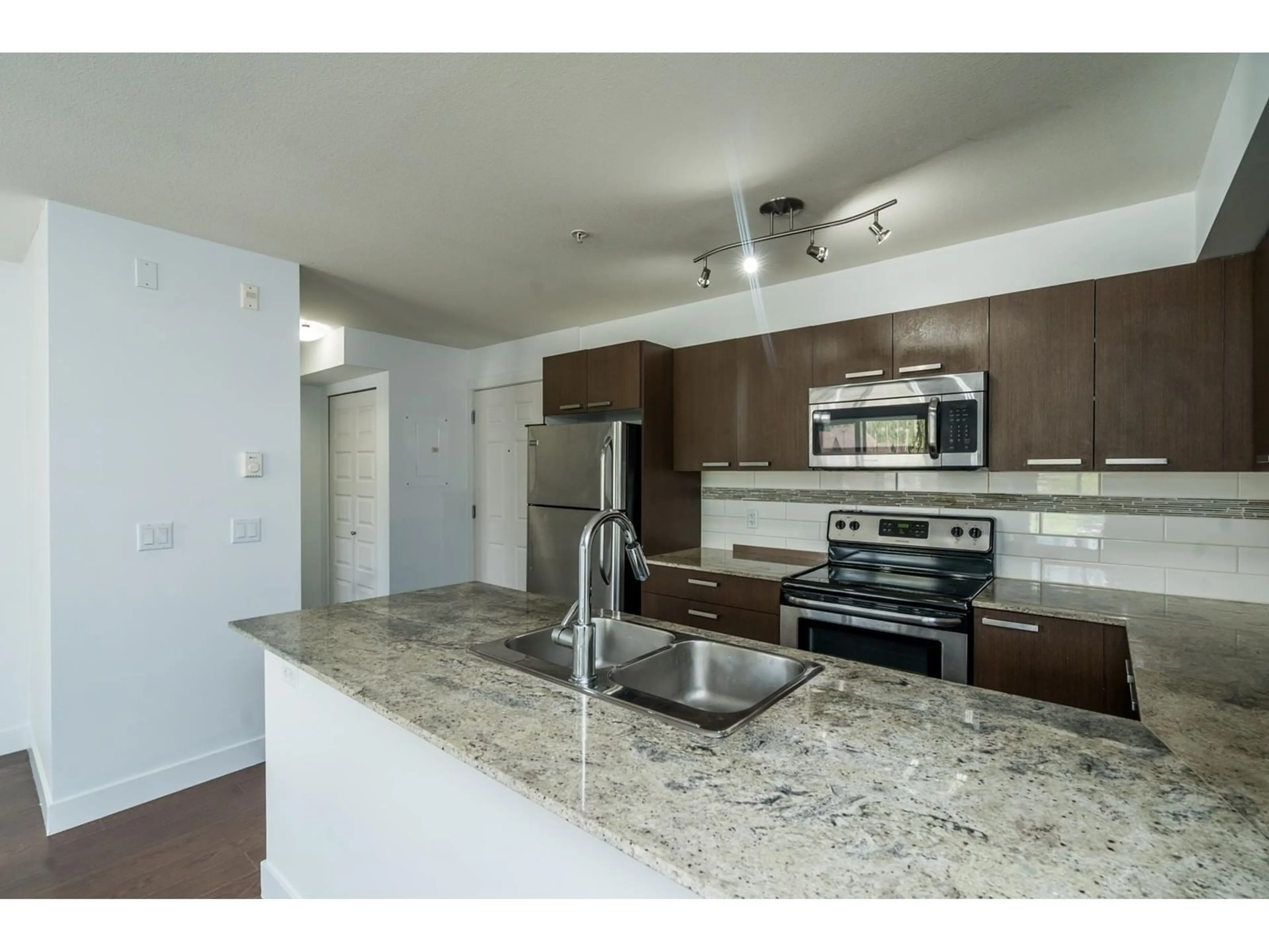 Open concept kitchen, unknown for 515 13883 LAUREL DRIVE, Surrey British Columbia V3T1A8