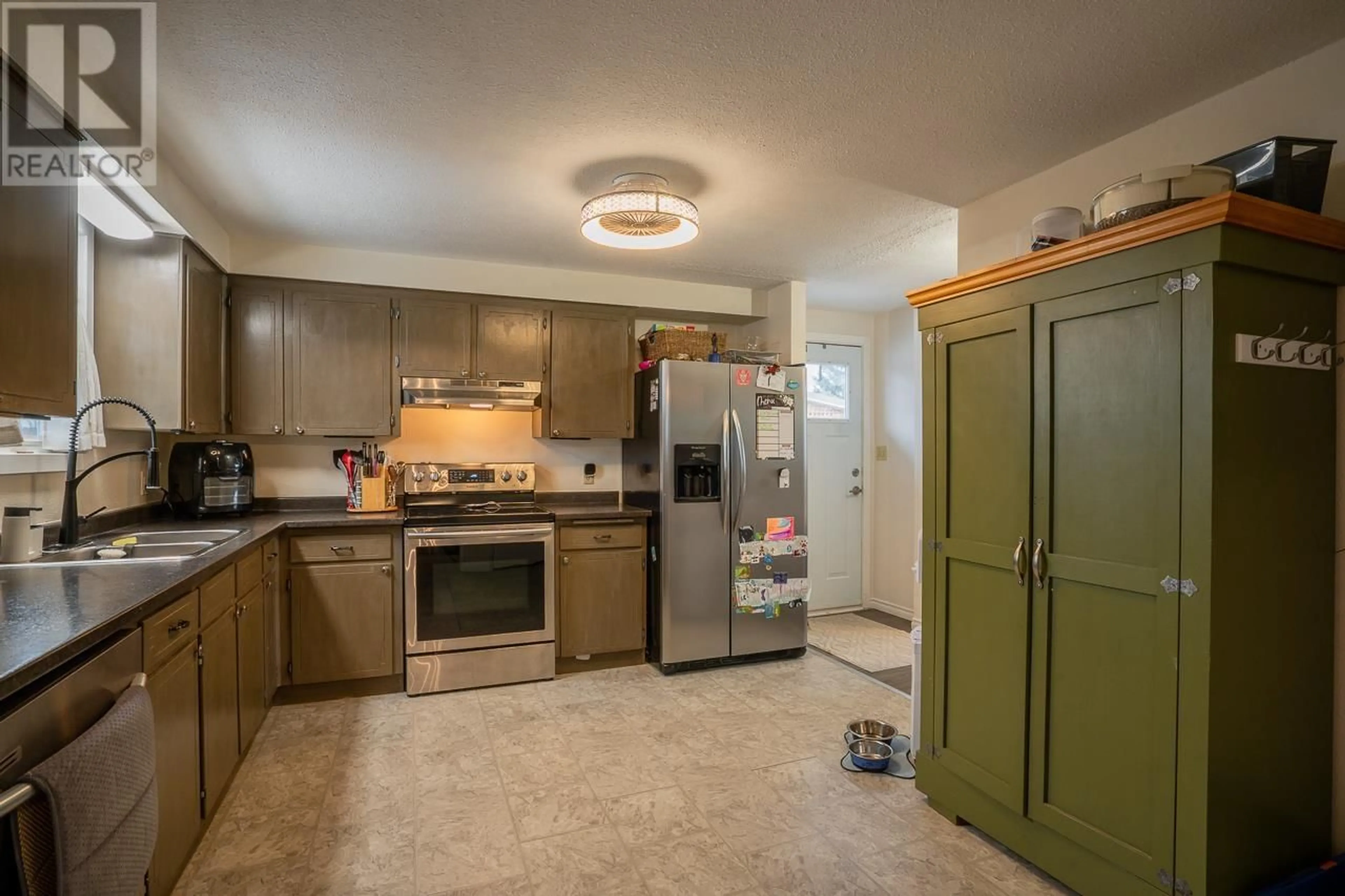 Standard kitchen, ceramic/tile floor for 261 ELM AVENUE, 100 Mile House British Columbia V0K2E0