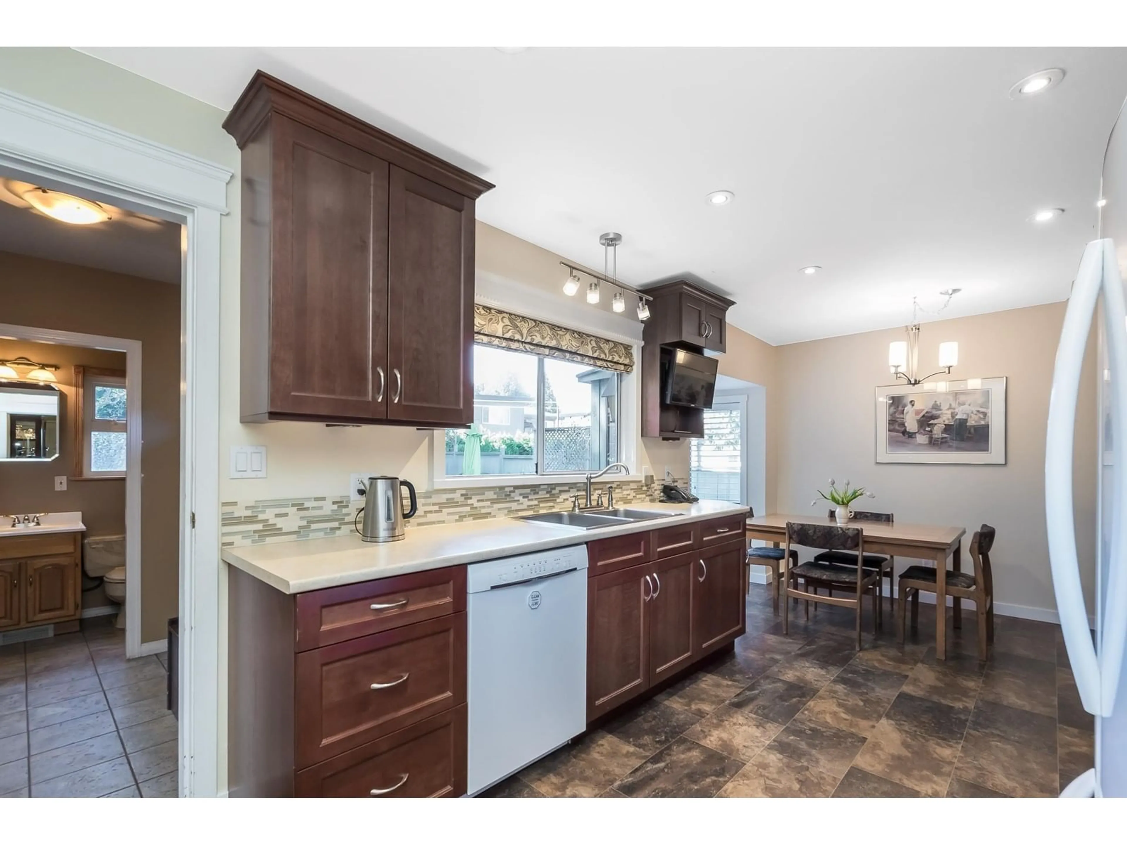 Open concept kitchen, ceramic/tile floor for 11564 97 AVENUE, Surrey British Columbia V3V2B6