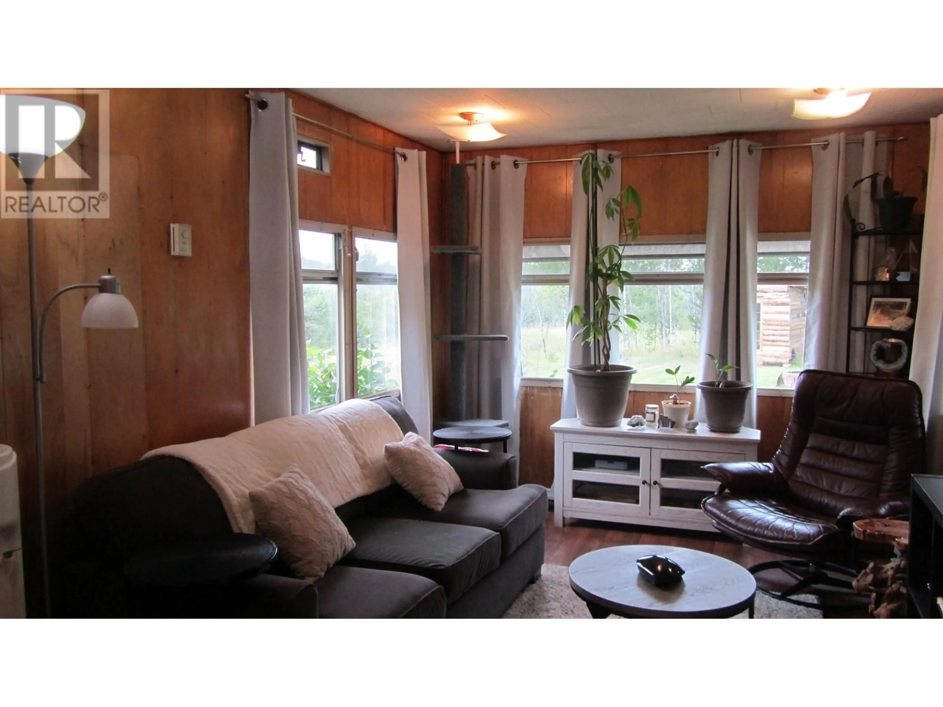 Living room with furniture, wood/laminate floor for 5662 HORSE LAKE ROAD, 100 Mile House British Columbia V0K2E3