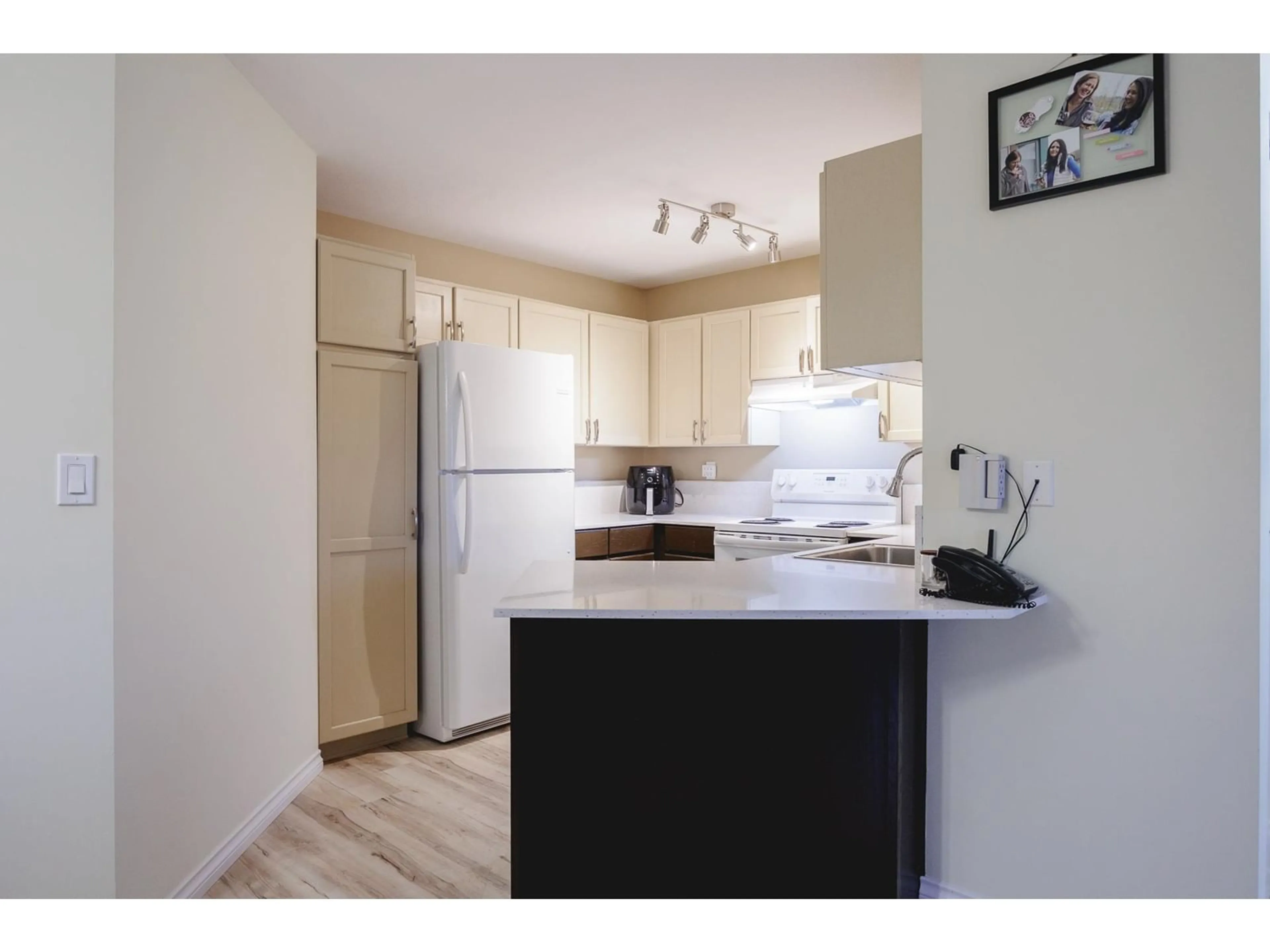 Standard kitchen, wood/laminate floor for 306 17695 58 AVENUE, Surrey British Columbia V3S1L5