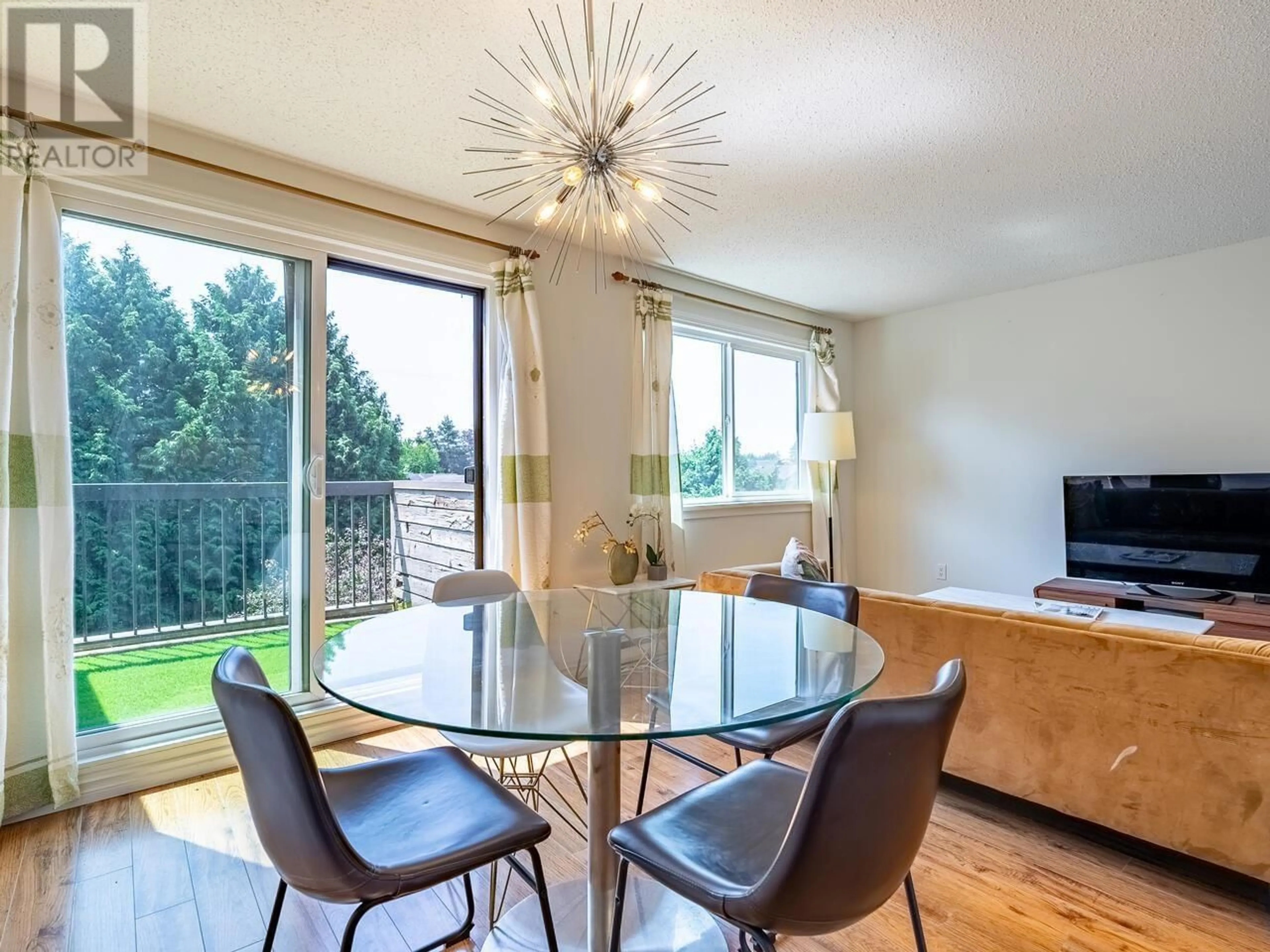 Dining room, wood/laminate floor for 211 8180 COLONIAL DRIVE, Richmond British Columbia V7C4T7