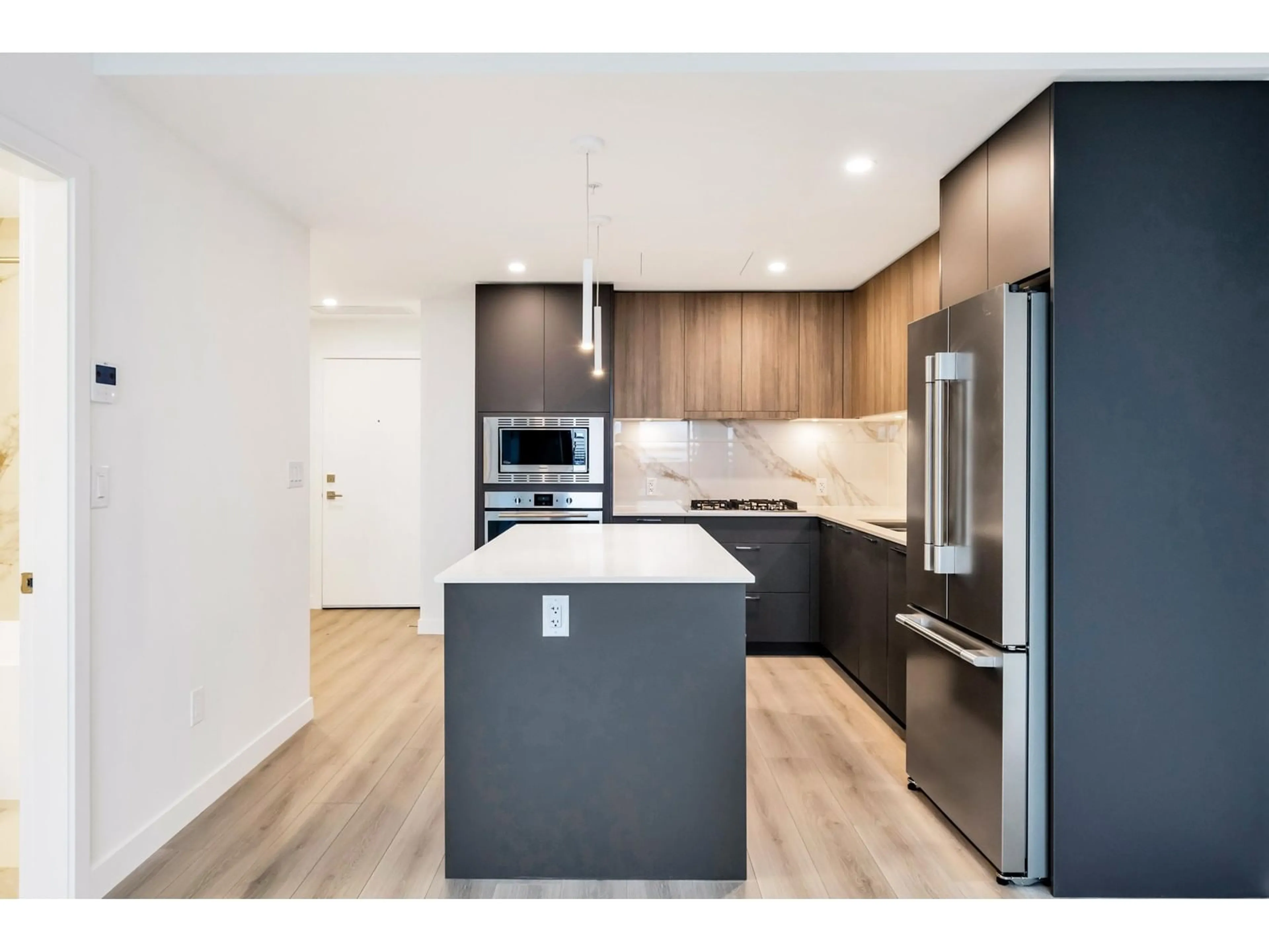 Open concept kitchen, wood/laminate floor for 2406 20065 85 AVENUE, Langley British Columbia V2Y3Y4