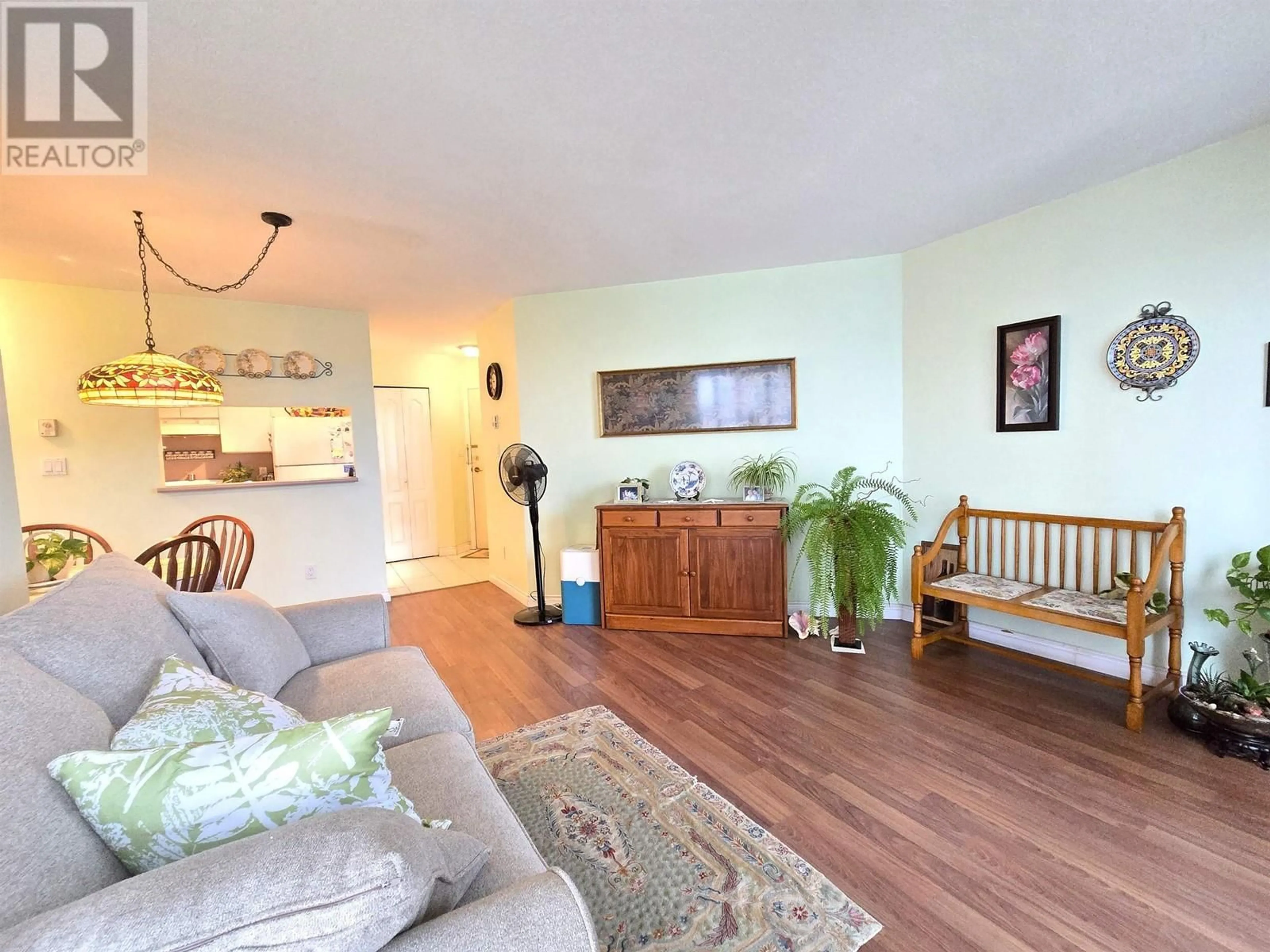 Living room with furniture, wood/laminate floor for 610 3455 ASCOT PLACE, Vancouver British Columbia V5R6B7