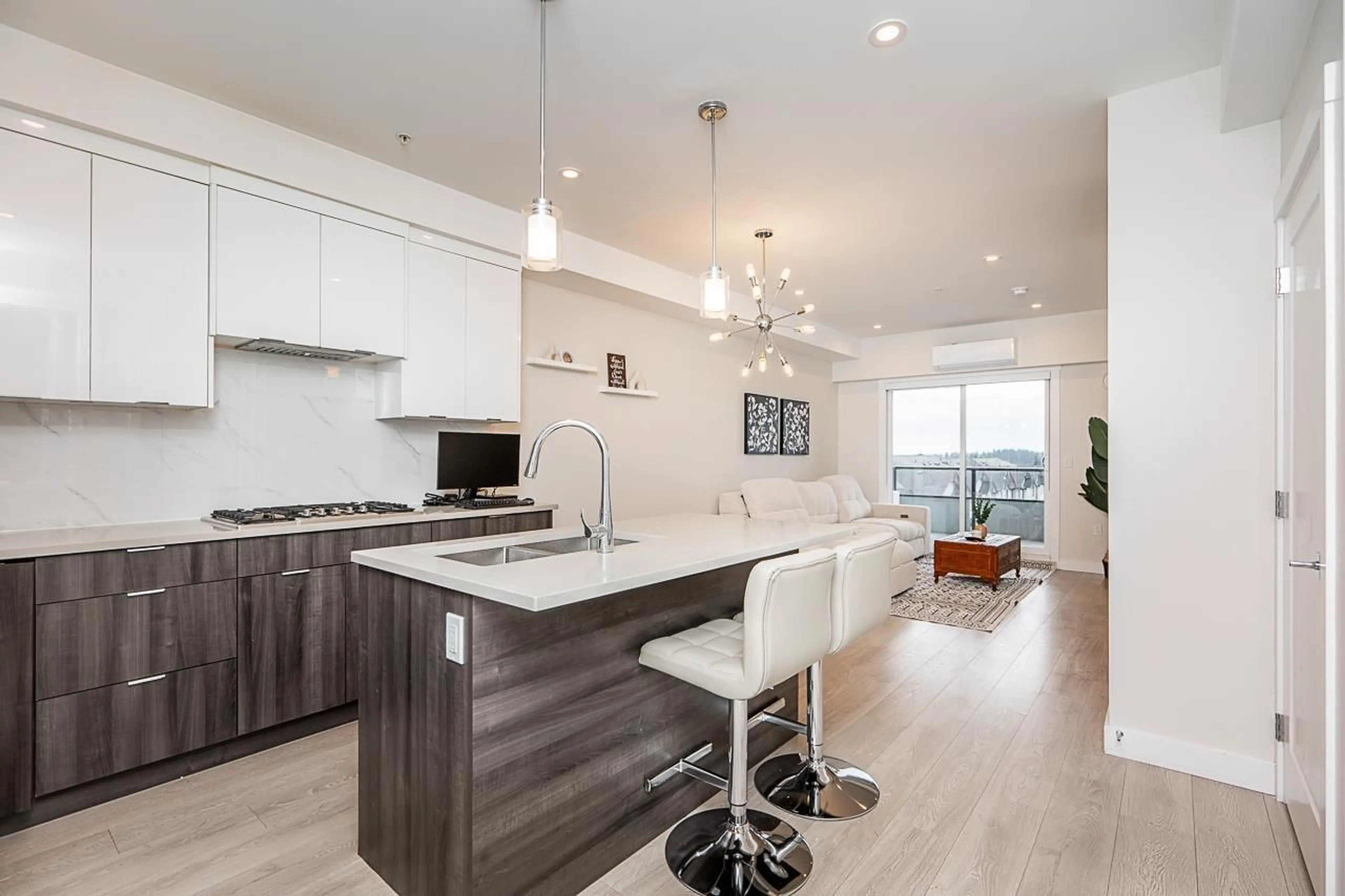 Open concept kitchen, wood/laminate floor for A402 14468 72 AVENUE, Surrey British Columbia V3S2E7