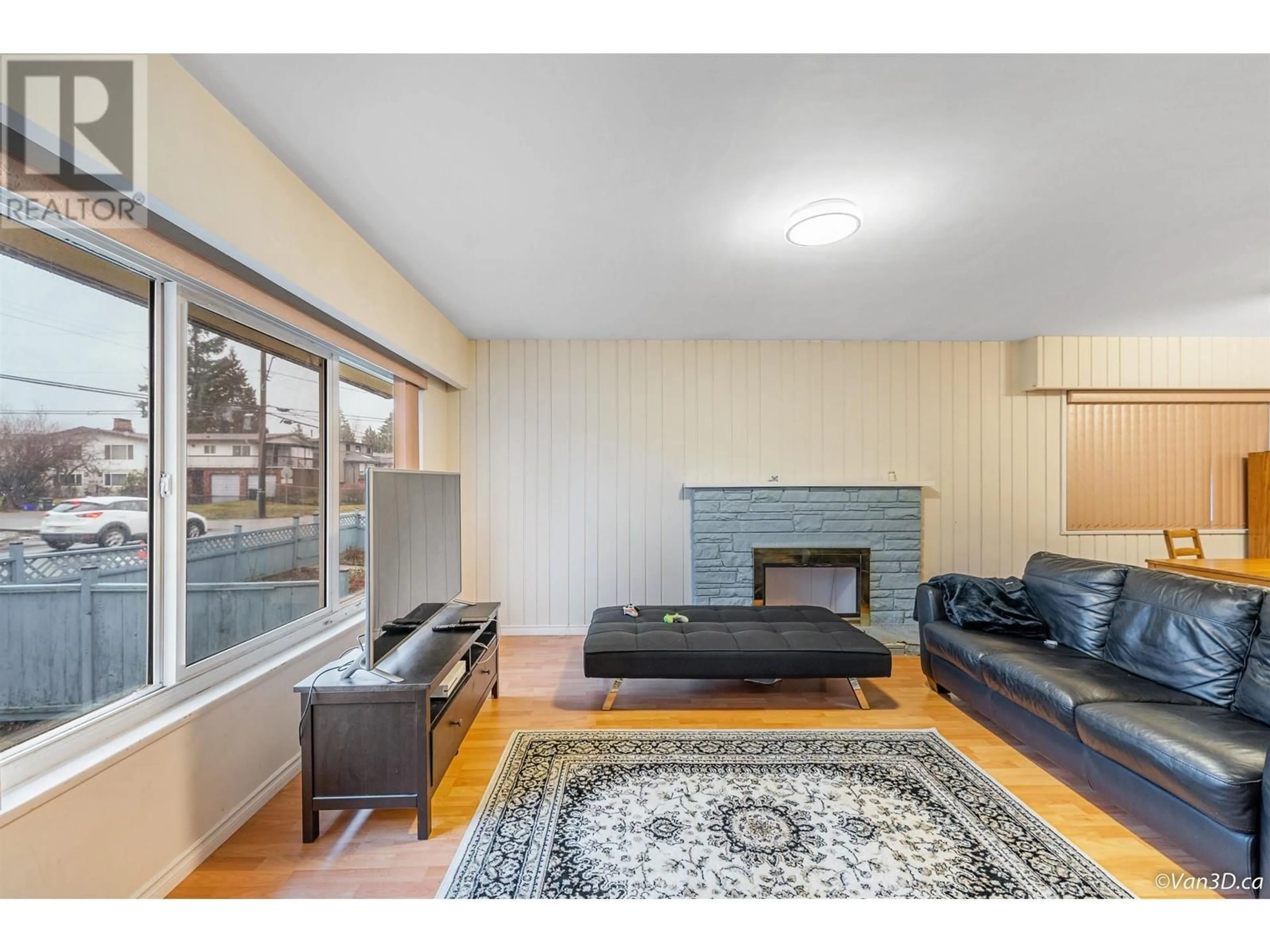 Living room with furniture, wood/laminate floor for 8288 12TH AVENUE, Burnaby British Columbia V3N2L4