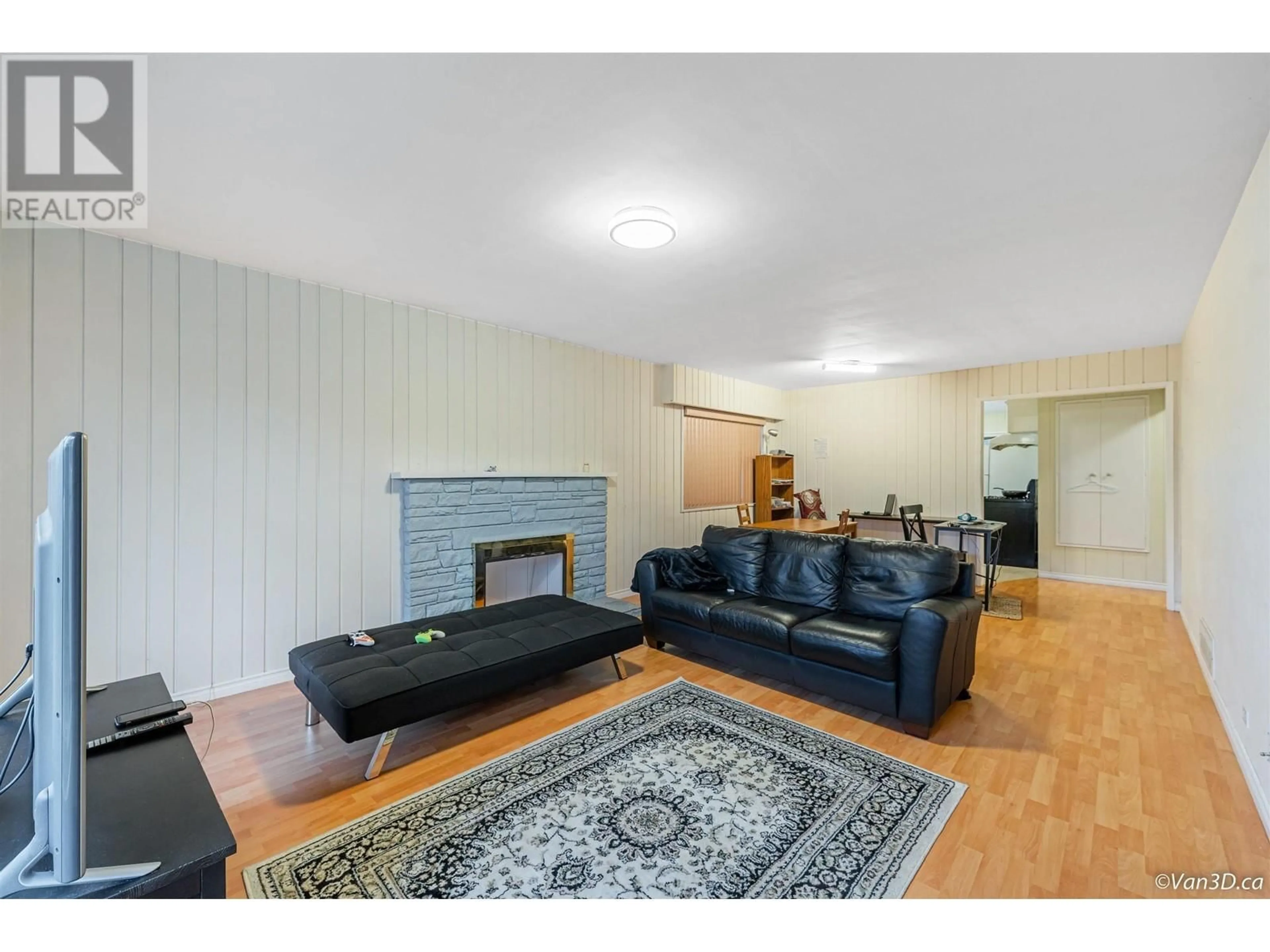 Living room with furniture, wood/laminate floor for 8288 12TH AVENUE, Burnaby British Columbia V3N2L4