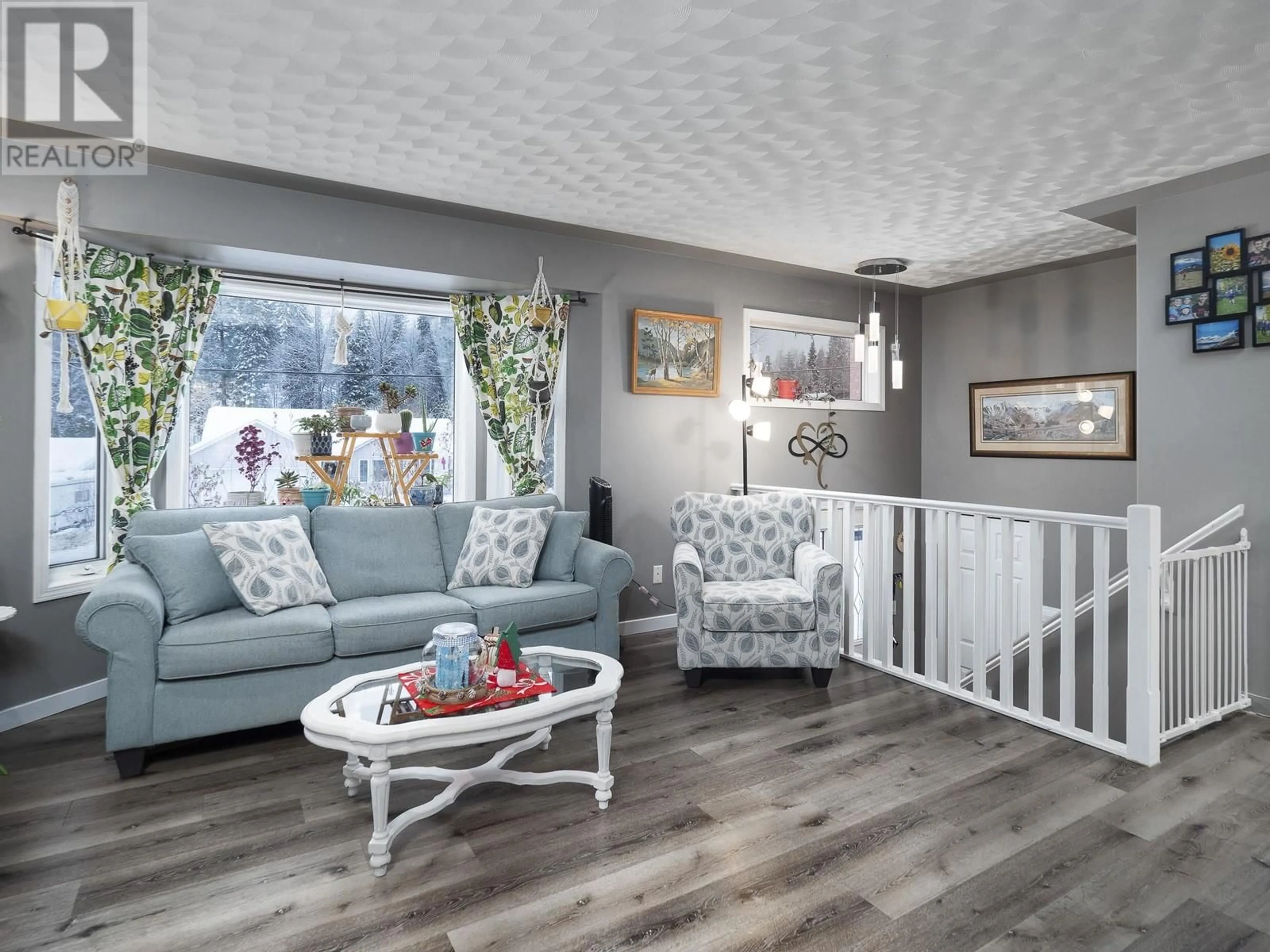 Living room with furniture, wood/laminate floor for 2048 CROFT ROAD, Prince George British Columbia V2K3C9