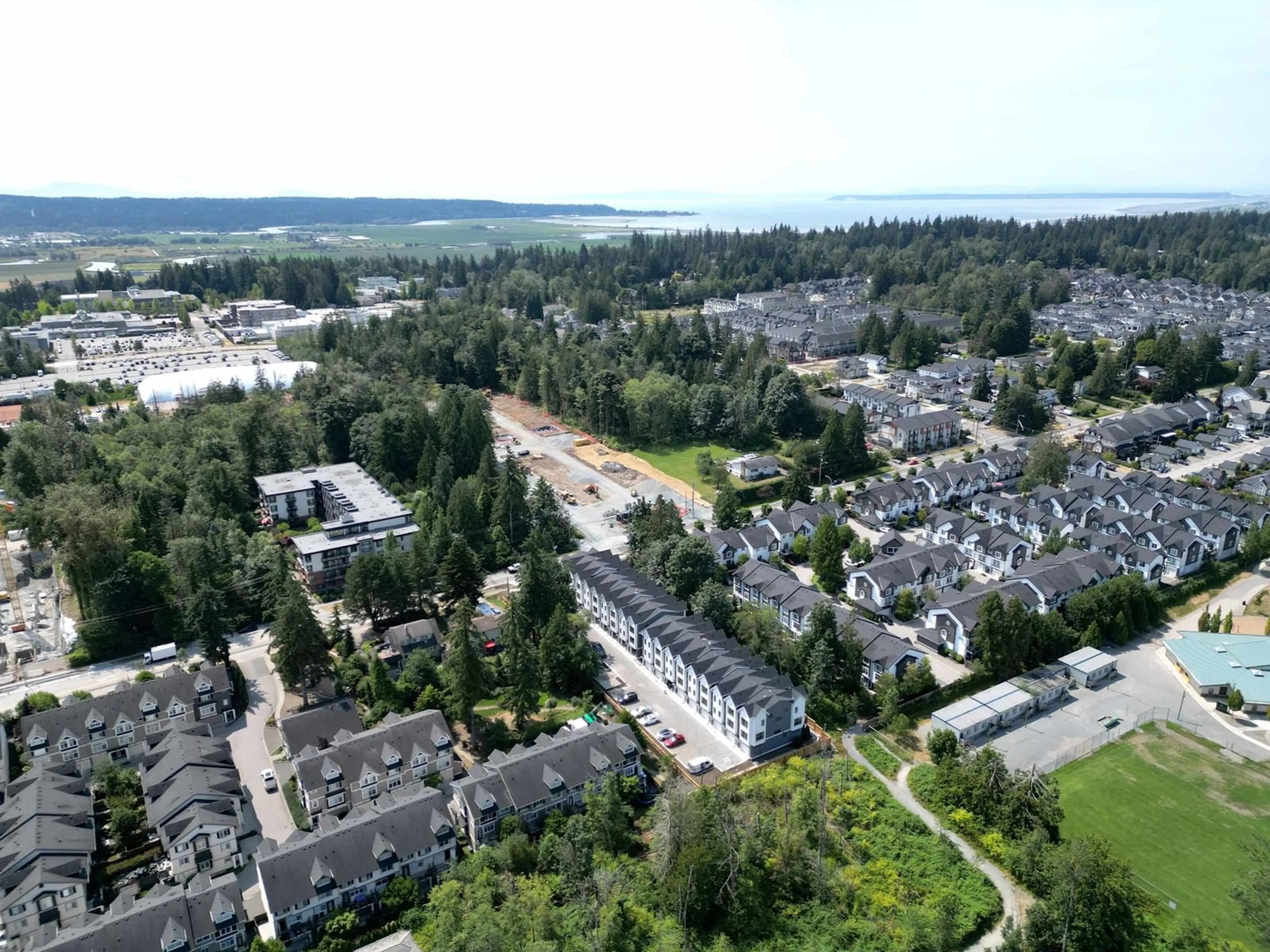 A pic from outside/outdoor area/front of a property/back of a property/a pic from drone, street for 4 14311 60 AVENUE, Surrey British Columbia V3X2N4