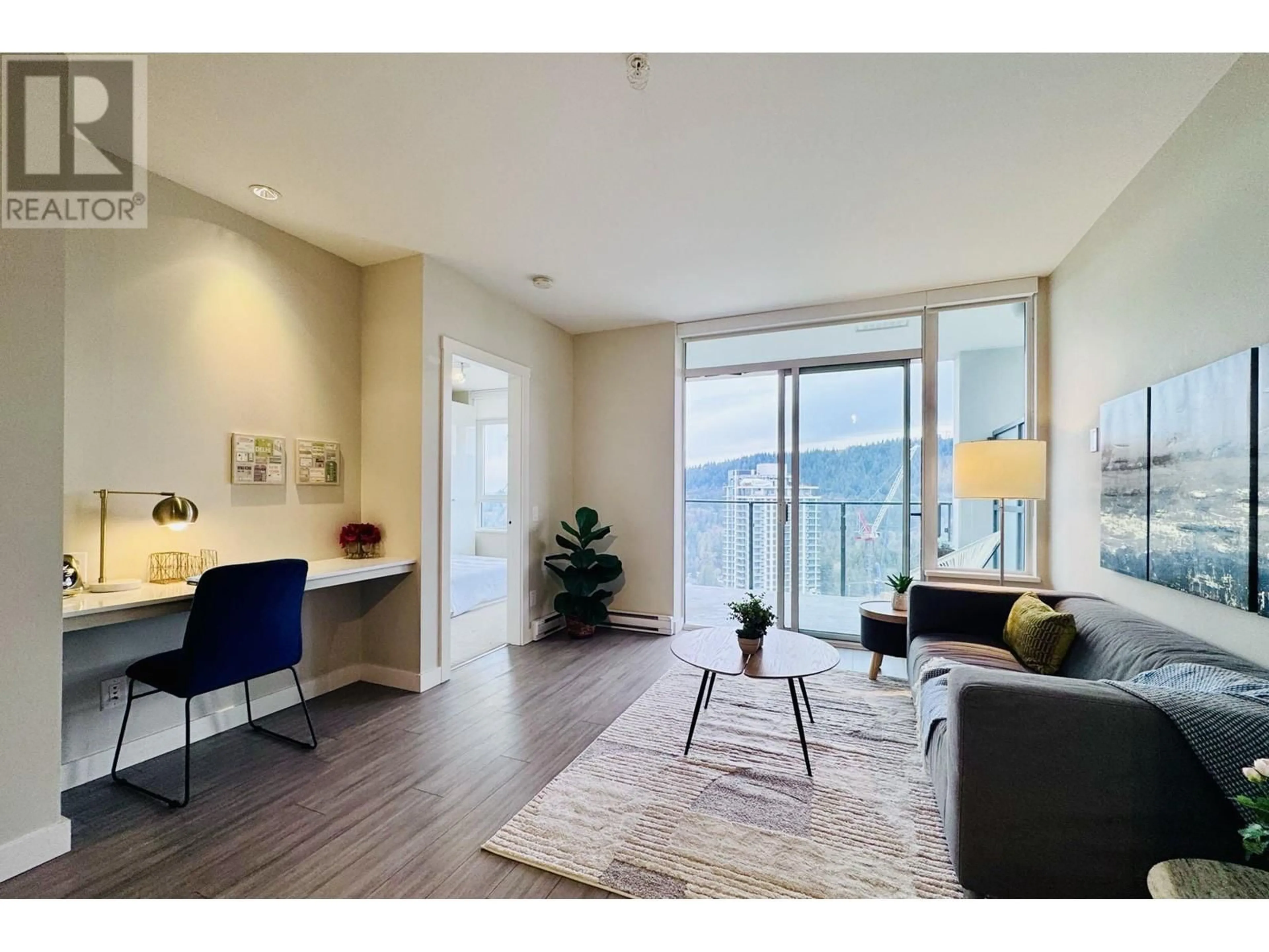 Living room with furniture, wood/laminate floor for 2608 602 COMO LAKE AVENUE, Coquitlam British Columbia V3J0G2