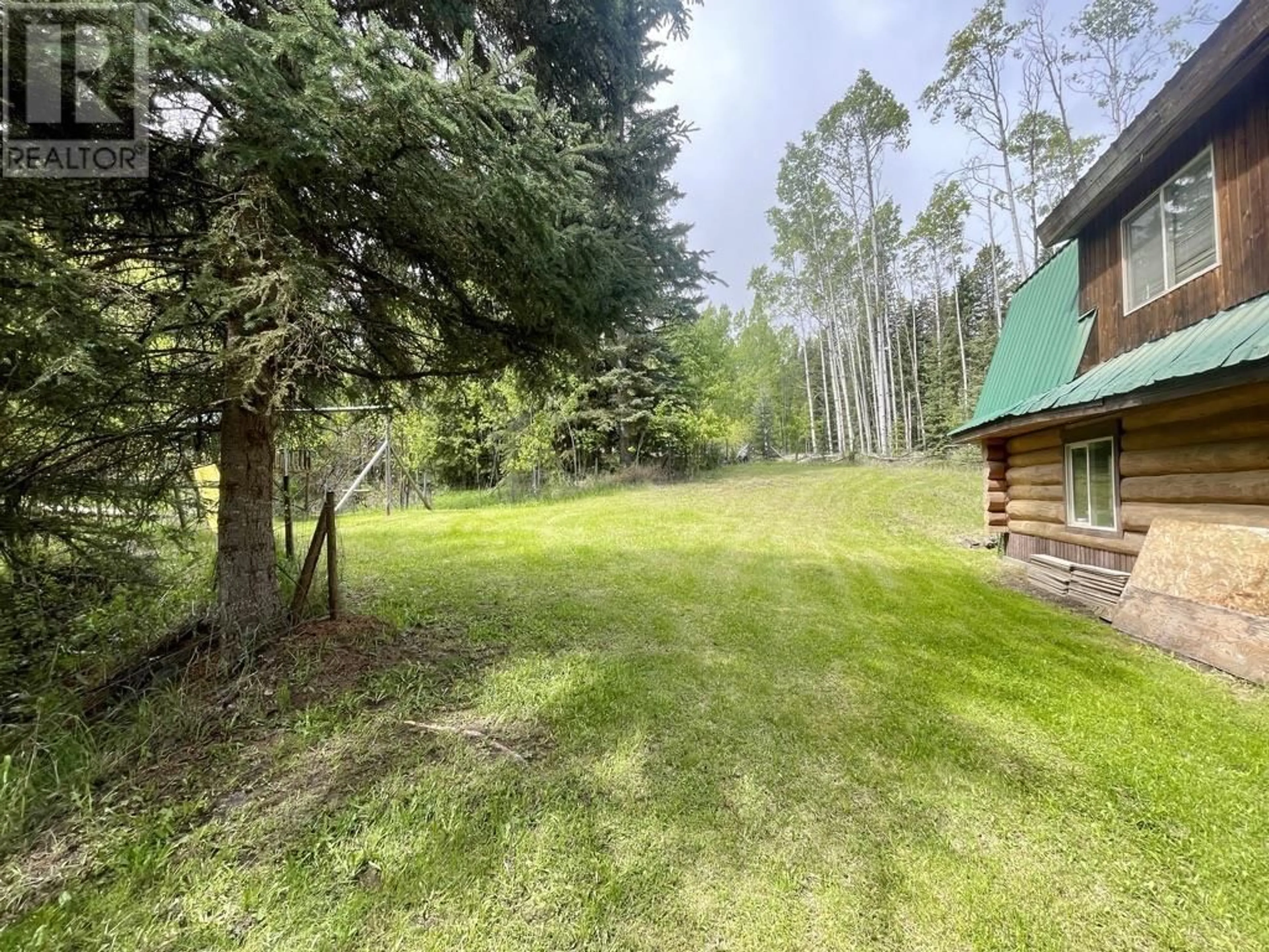 A pic from outside/outdoor area/front of a property/back of a property/a pic from drone, forest/trees view for 6192 HUNT ROAD, 100 Mile House British Columbia V0K2E3