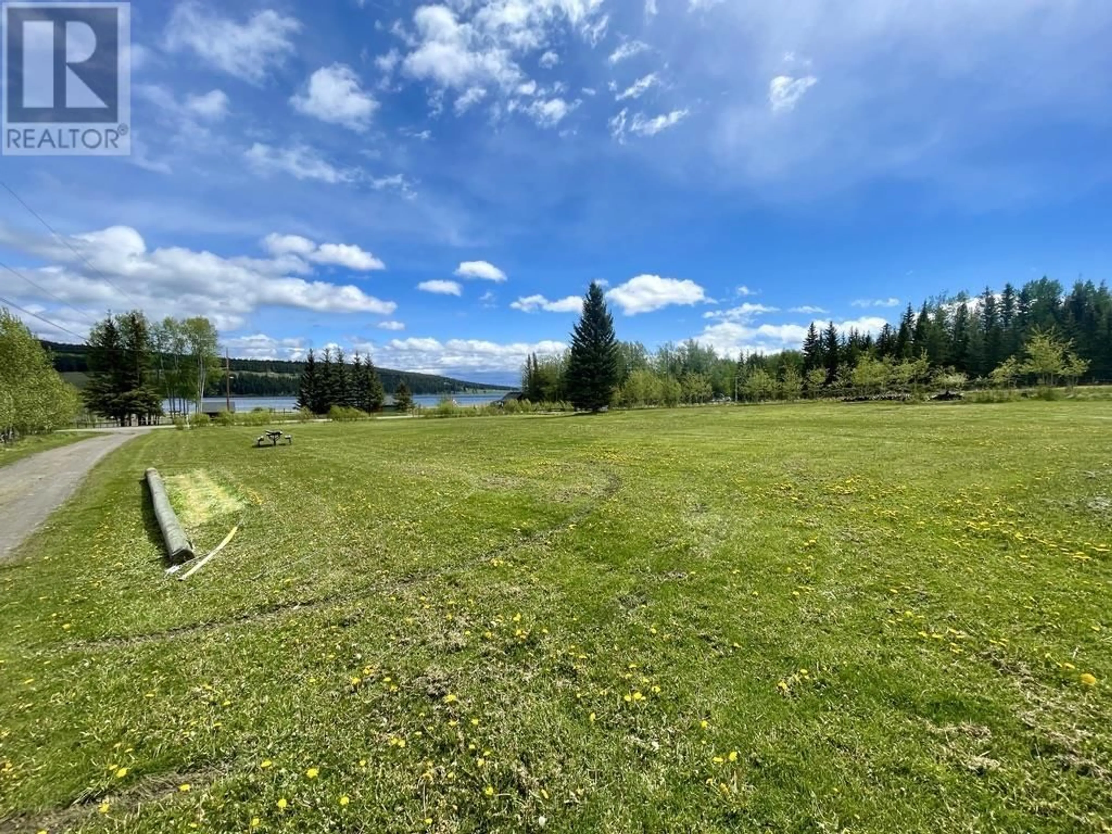 A pic from outside/outdoor area/front of a property/back of a property/a pic from drone, water/lake/river/ocean view for 6192 HUNT ROAD, 100 Mile House British Columbia V0K2E3