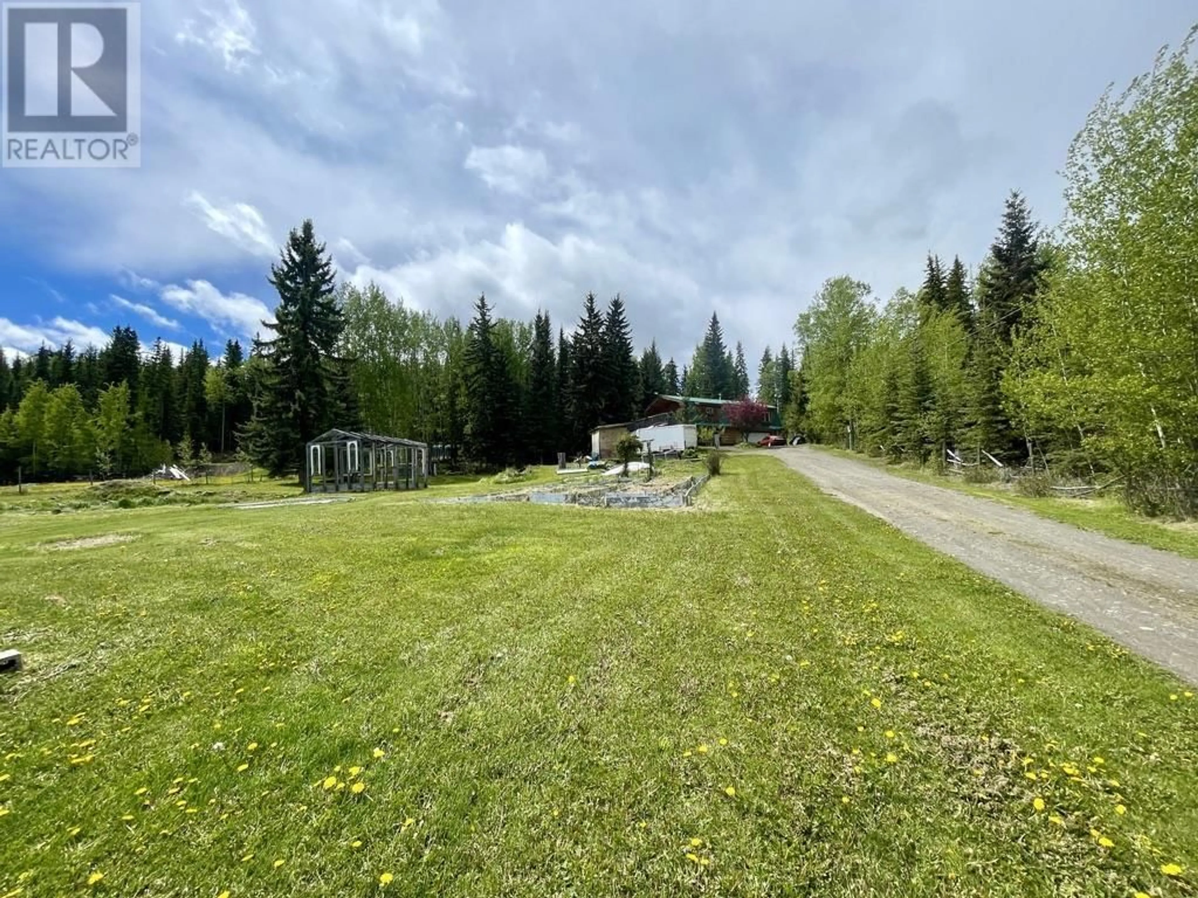 A pic from outside/outdoor area/front of a property/back of a property/a pic from drone, forest/trees view for 6192 HUNT ROAD, 100 Mile House British Columbia V0K2E3