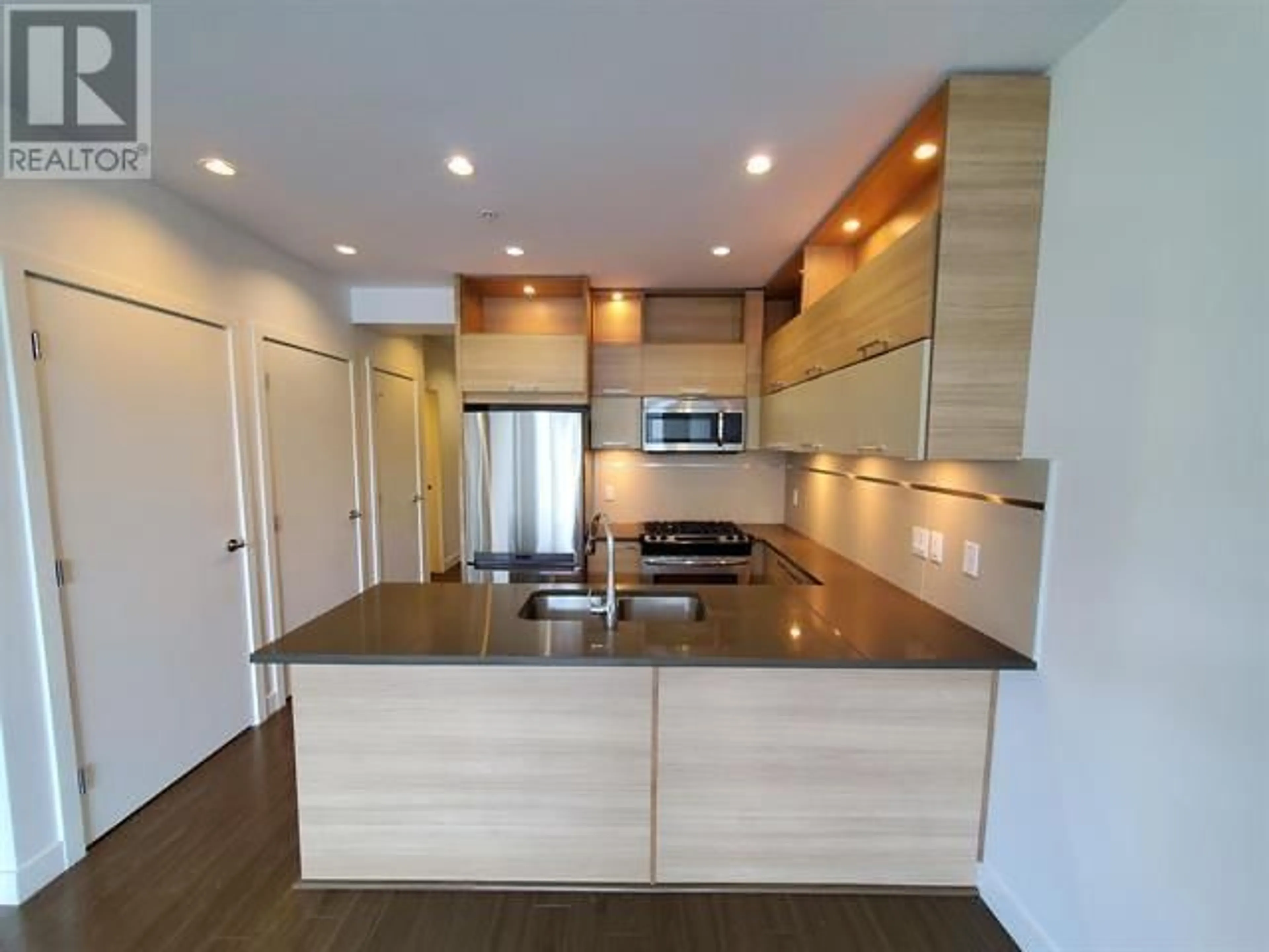 Open concept kitchen, wood/laminate floor for 214 9150 UNIVERSITY HIGH STREET, Burnaby British Columbia V5A0C5